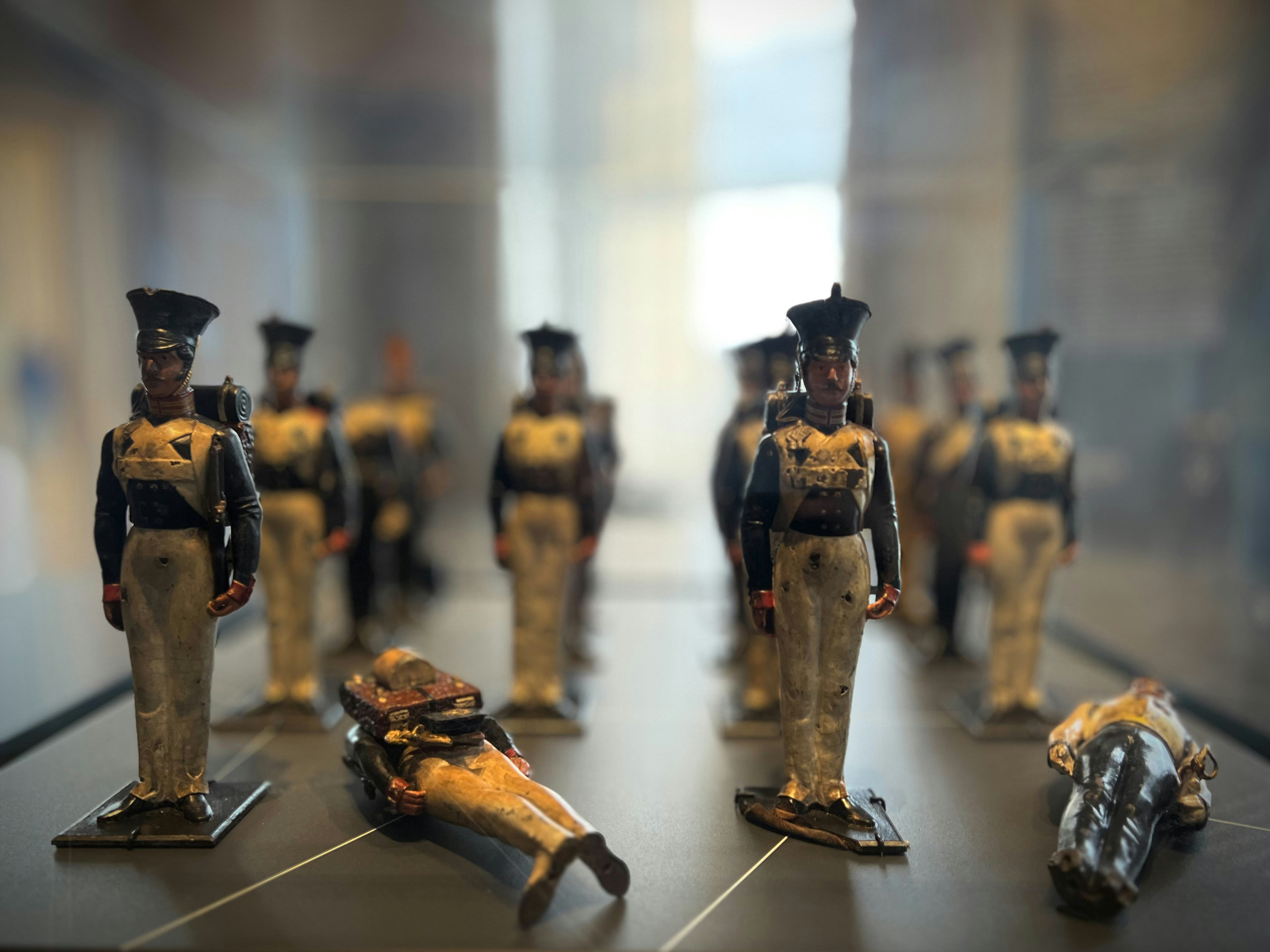 Toy soldiers in uniform stand in formation