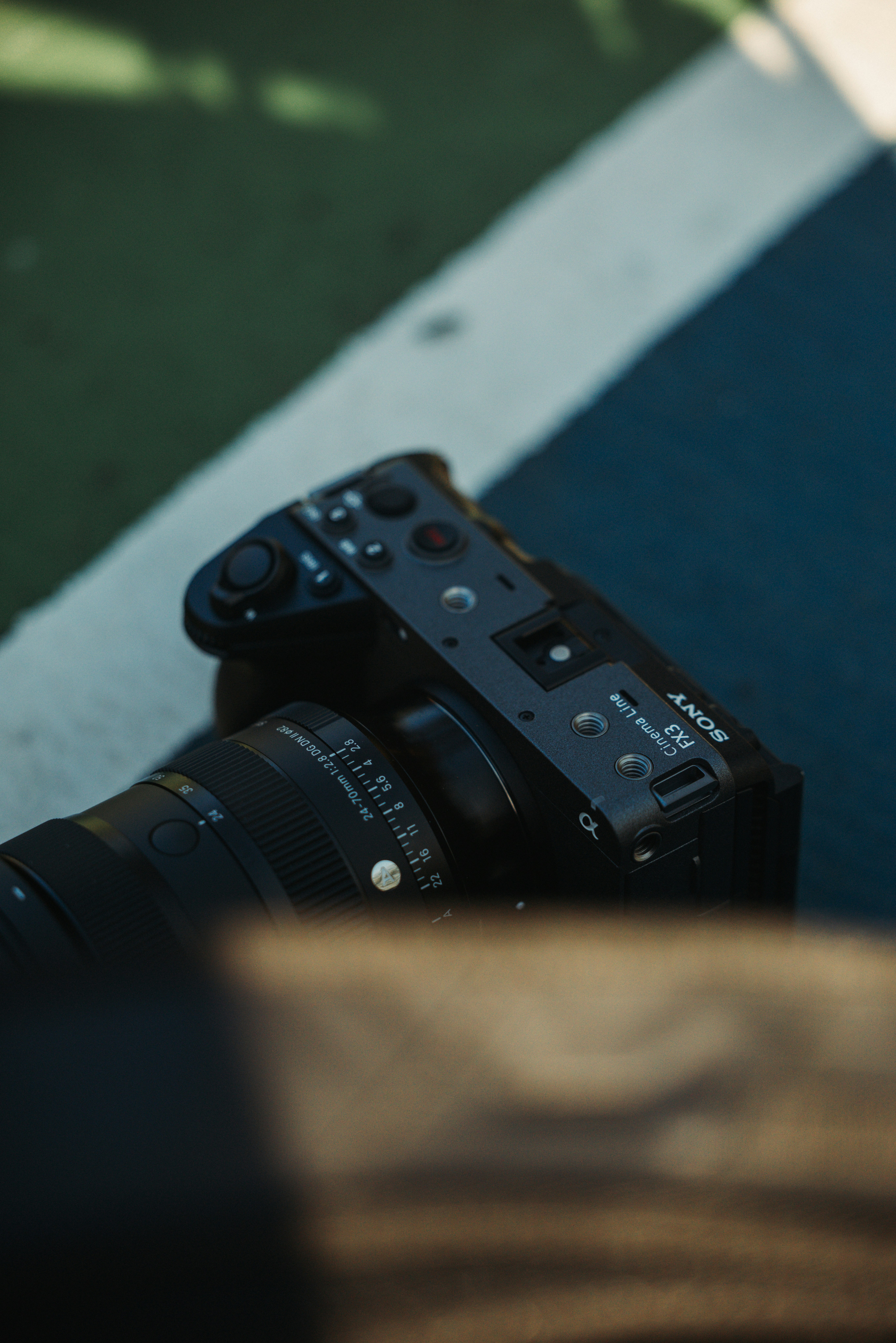 A black sony camera with a lens attached.