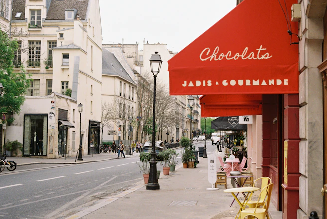 Charming parisian street with cafe and shops.