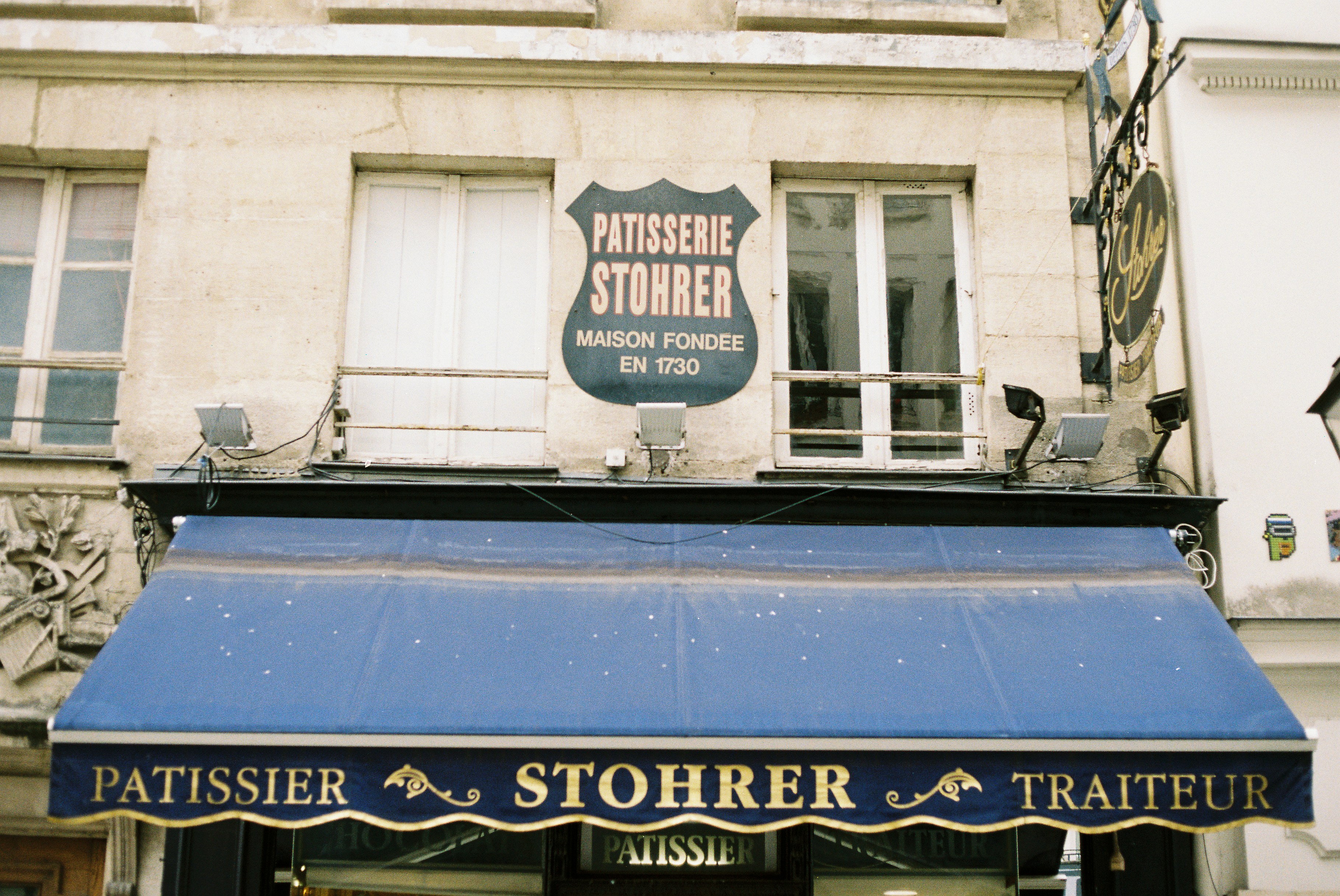 Patisserie stohrer storefront with blue awning
