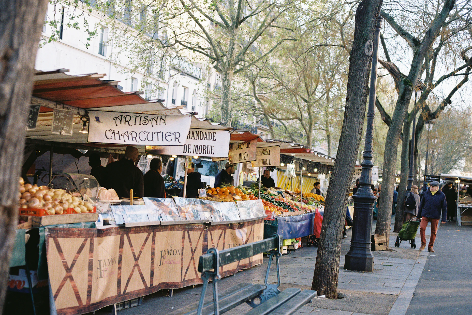 Open-air market stalls with fresh seasonal produce in Bordeaux