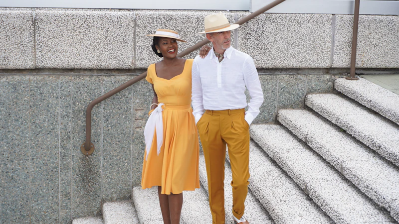 elegant couple in vintage style walking downstairs