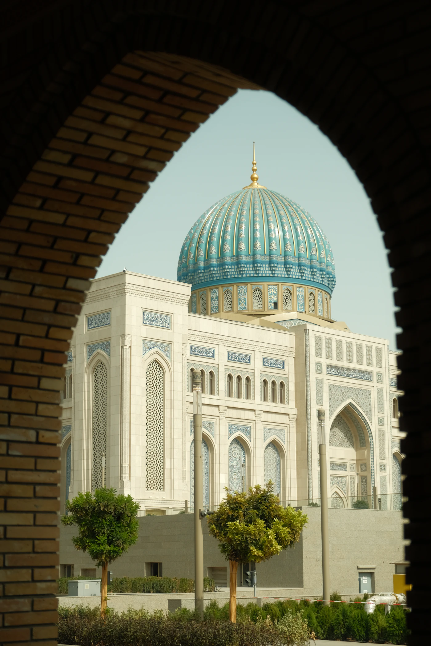 Ornate architecture and turquoise dome in Tashkent, Uzbekistan