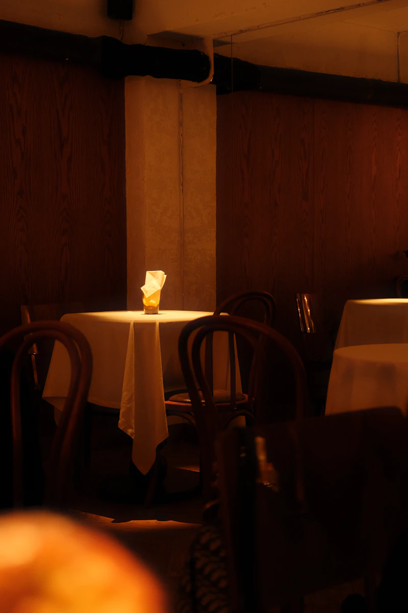A warm, dimly lit dining room in a private residence