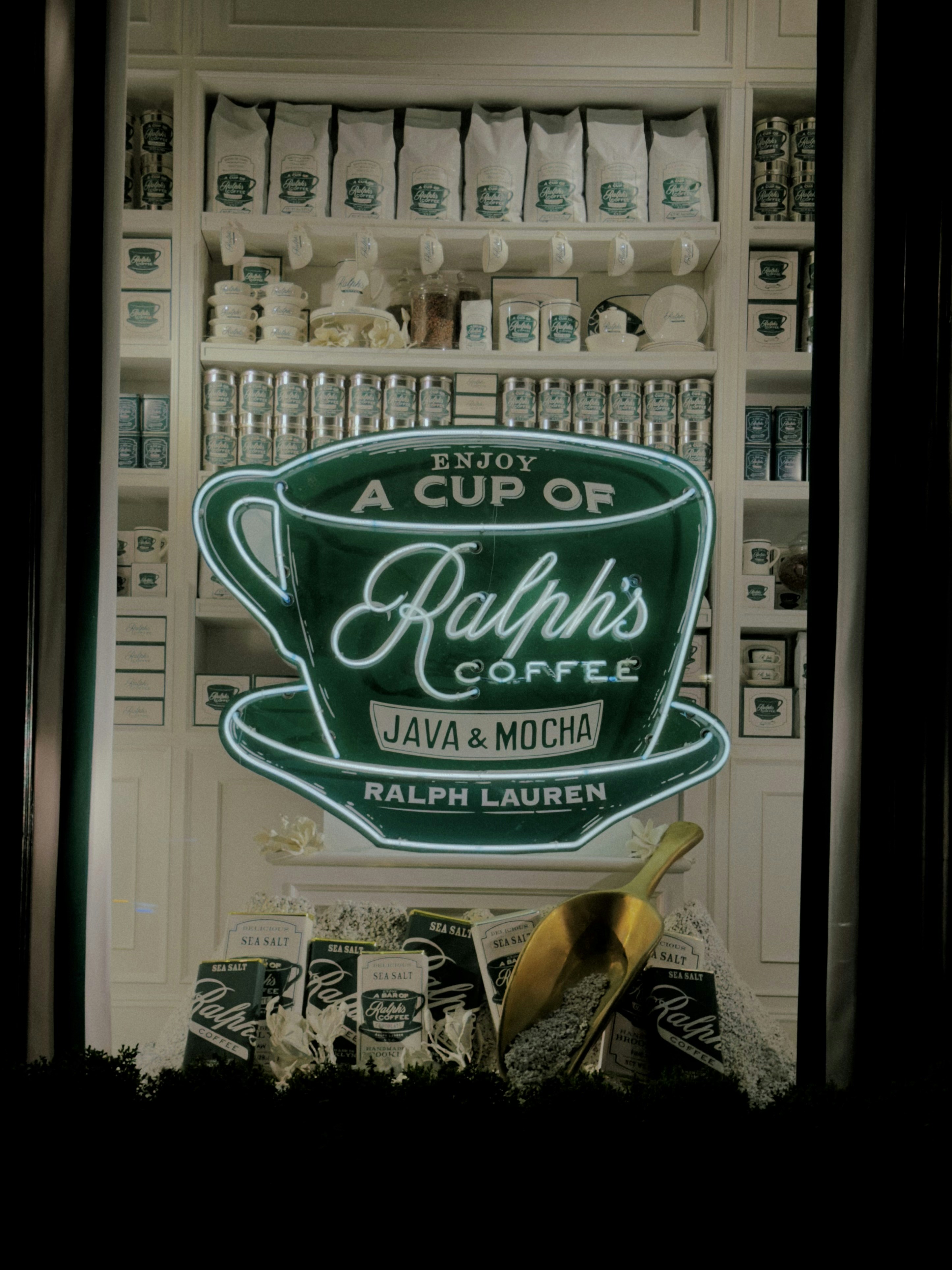 Ralph's coffee neon sign in a store window