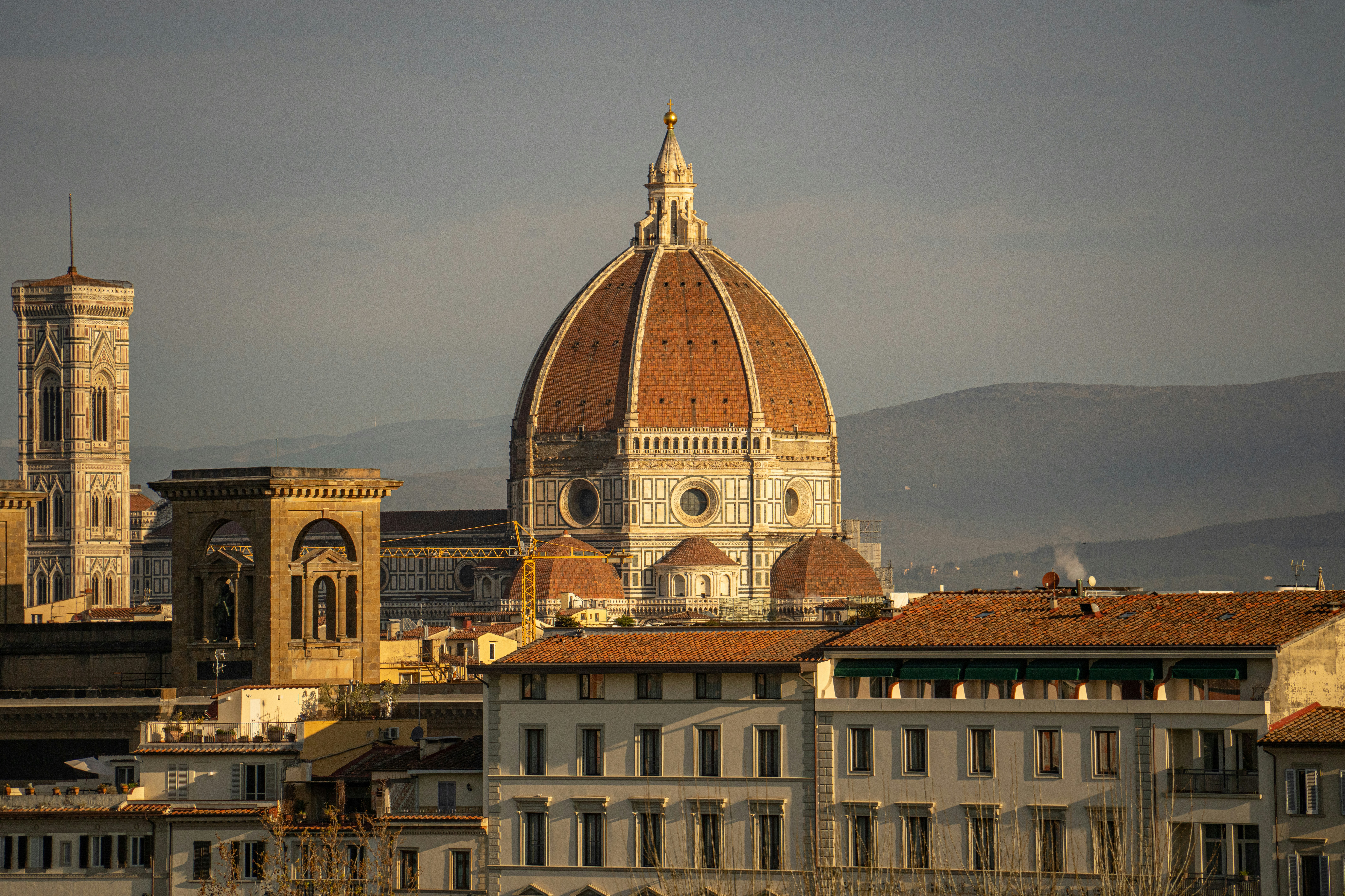 Florence cathedral dome and giotto's campanile at sunset.