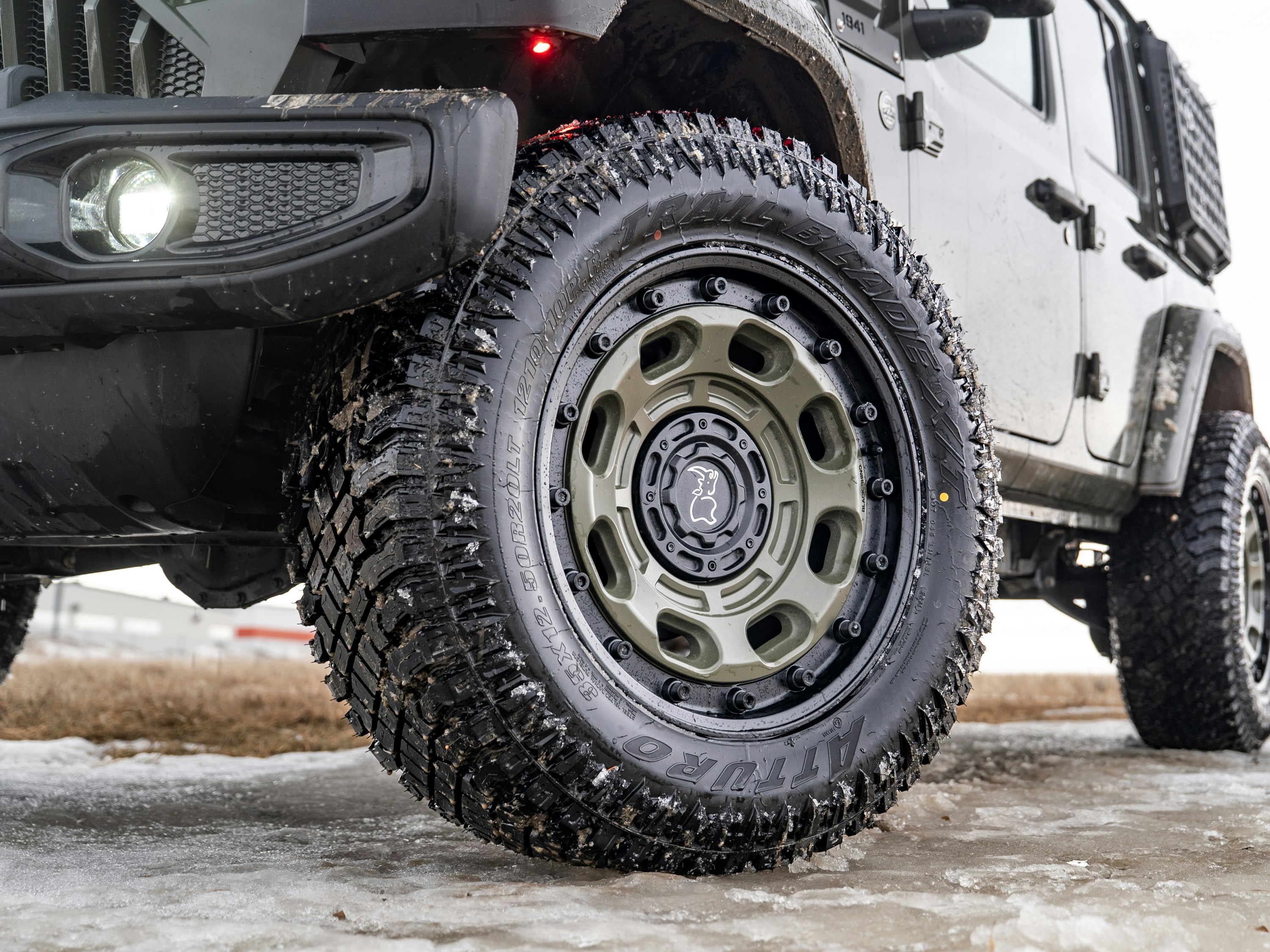 Close-up of a rugged off-road tire on a vehicle