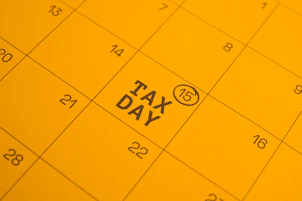 Calendar shows "tax day" circled on the 15th.