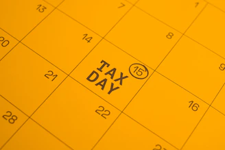 Calendar shows "tax day" circled on the 15th.