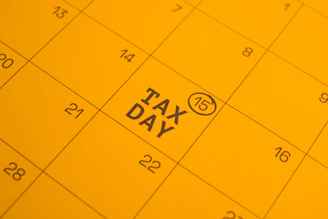 Calendar shows "tax day" circled on the 15th.