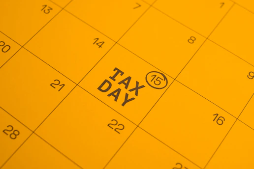 Calendar shows "tax day" circled on the 15th.