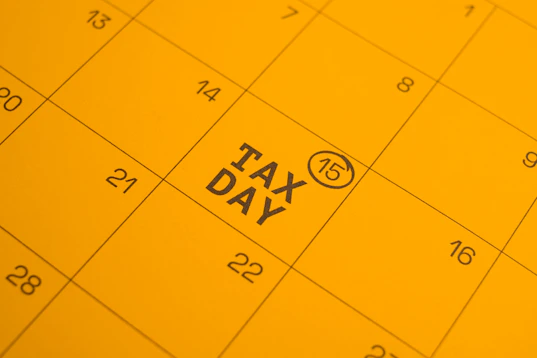 Calendar shows "tax day" circled on the 15th.