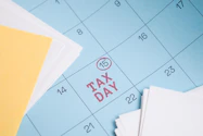 Calendar marked with "tax day" on the 15th