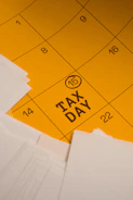 Calendar marked with tax day and circled date 15th circled