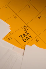 Calendar marked with tax day and circled date 15th circled