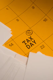Calendar marked with tax day and circled date 15th circled
