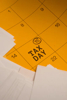 Calendar marked with tax day and circled date 15th circled