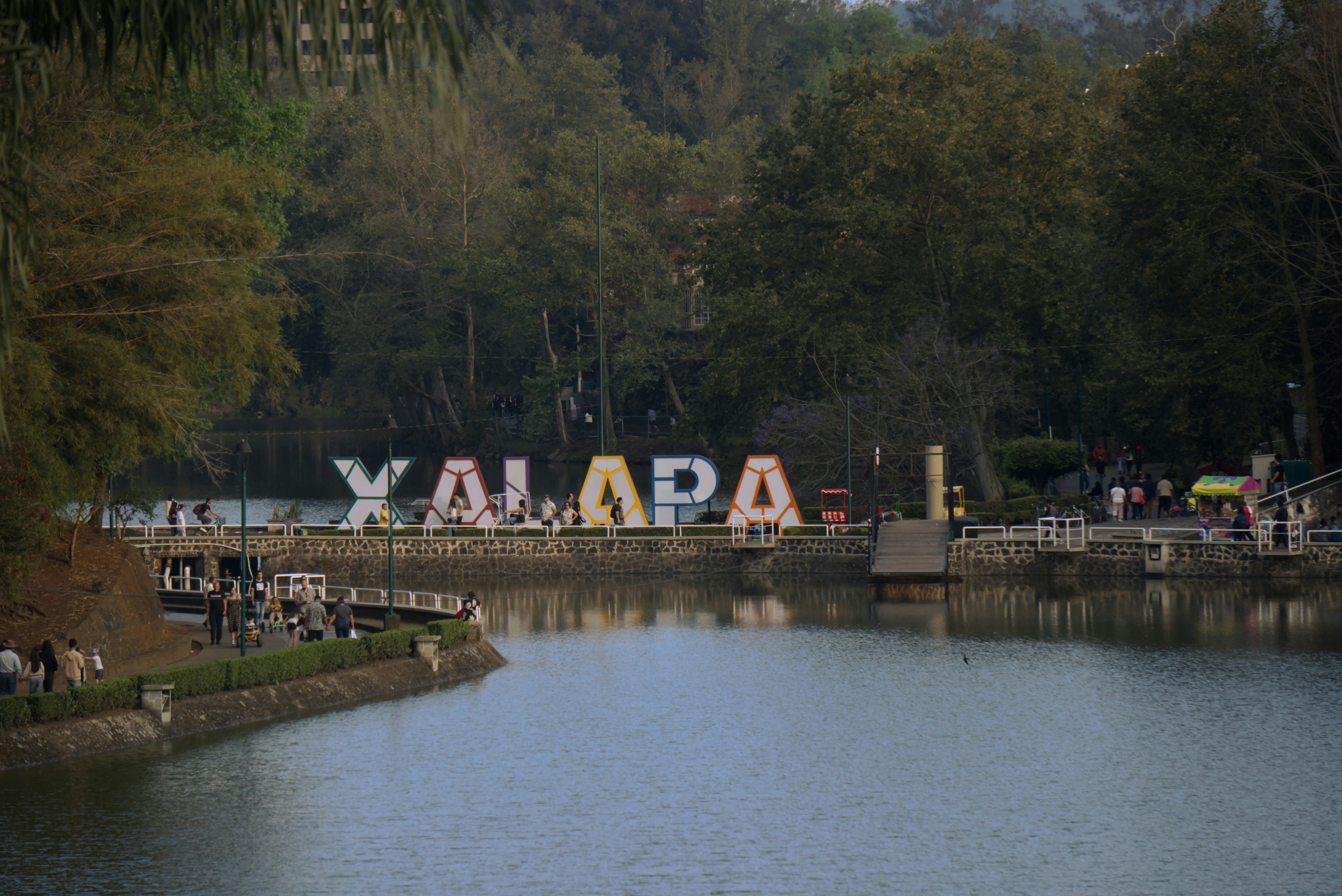 Large xalapa letters stand by a calm lake.
