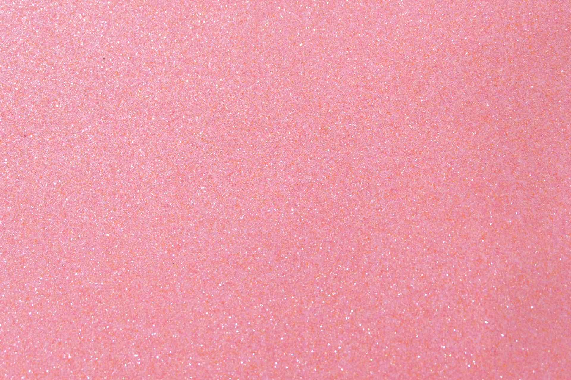 A soft pink background with subtle glitter accents.