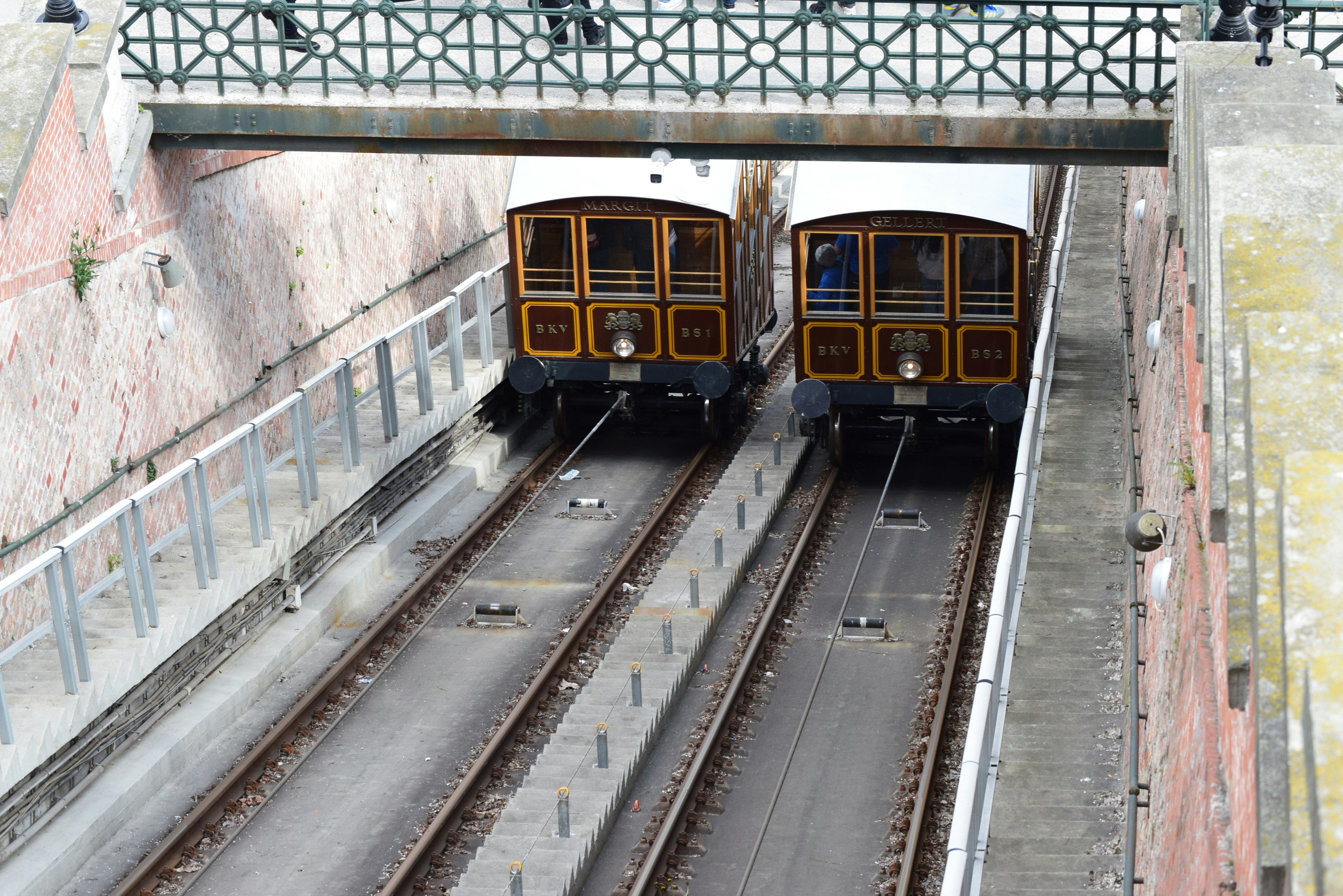 Two vintage funicular trains on parallel tracks
