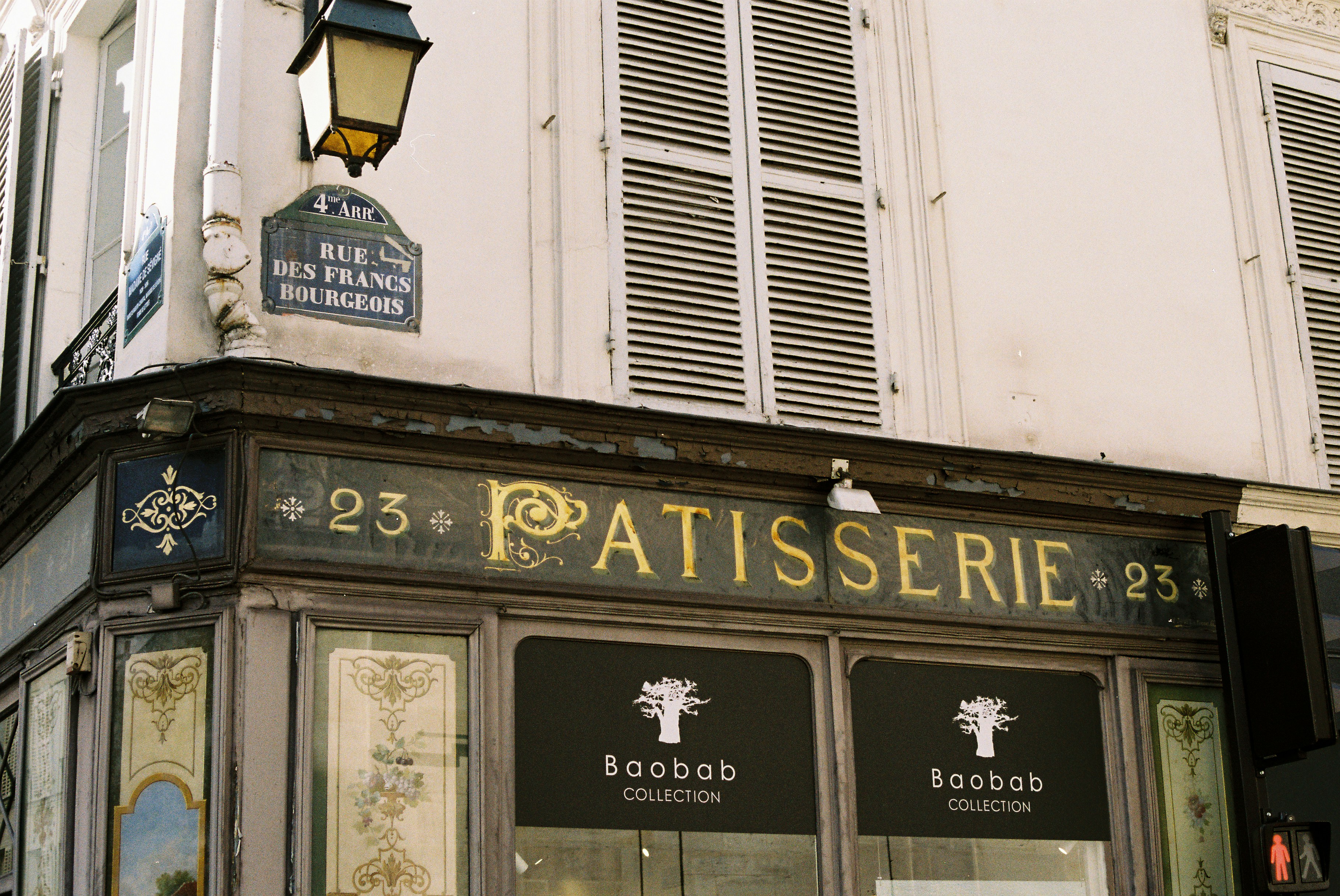 Parisian patisserie storefront with ornate signage