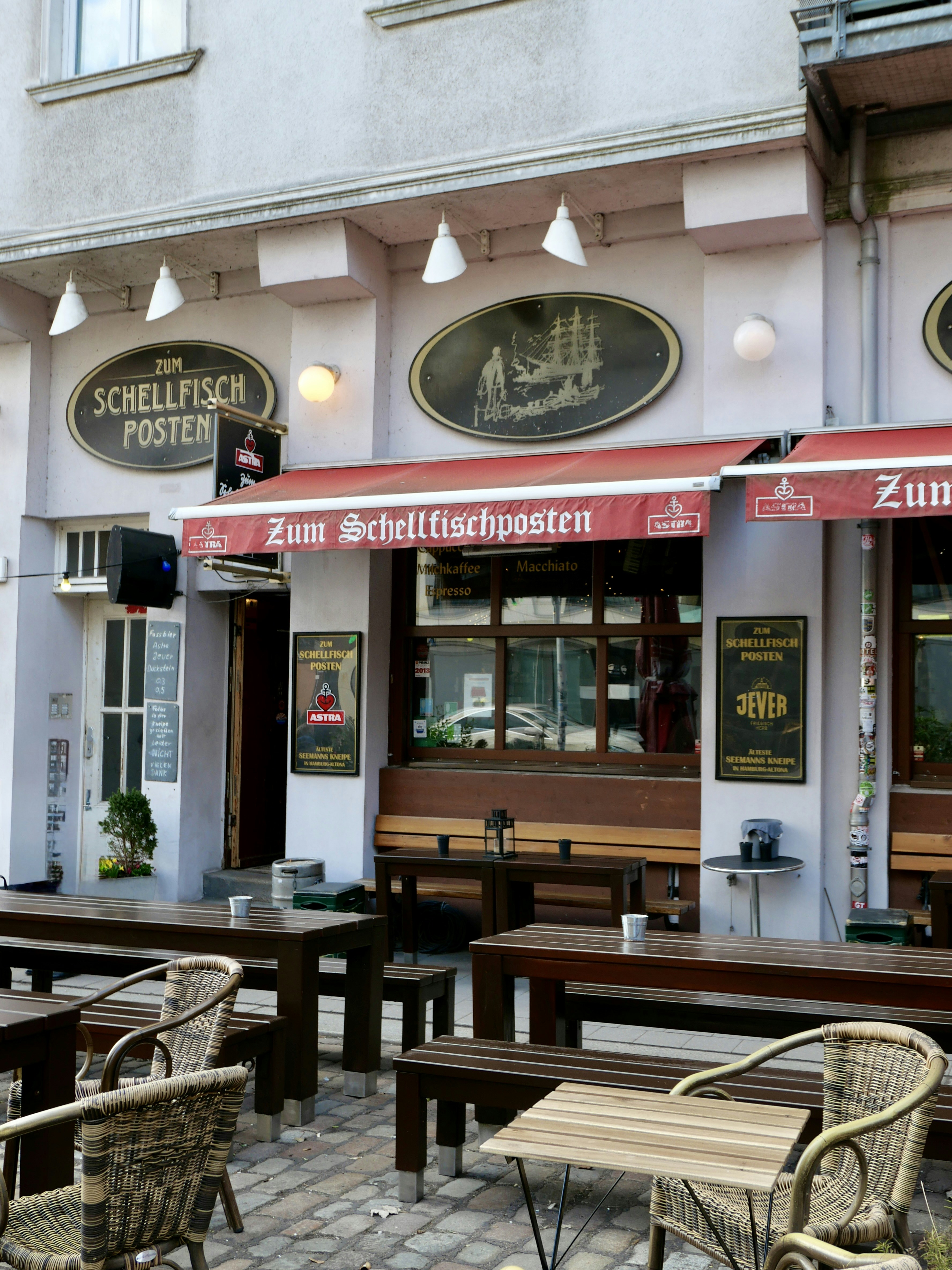 Restaurant exterior with outdoor seating and signage
