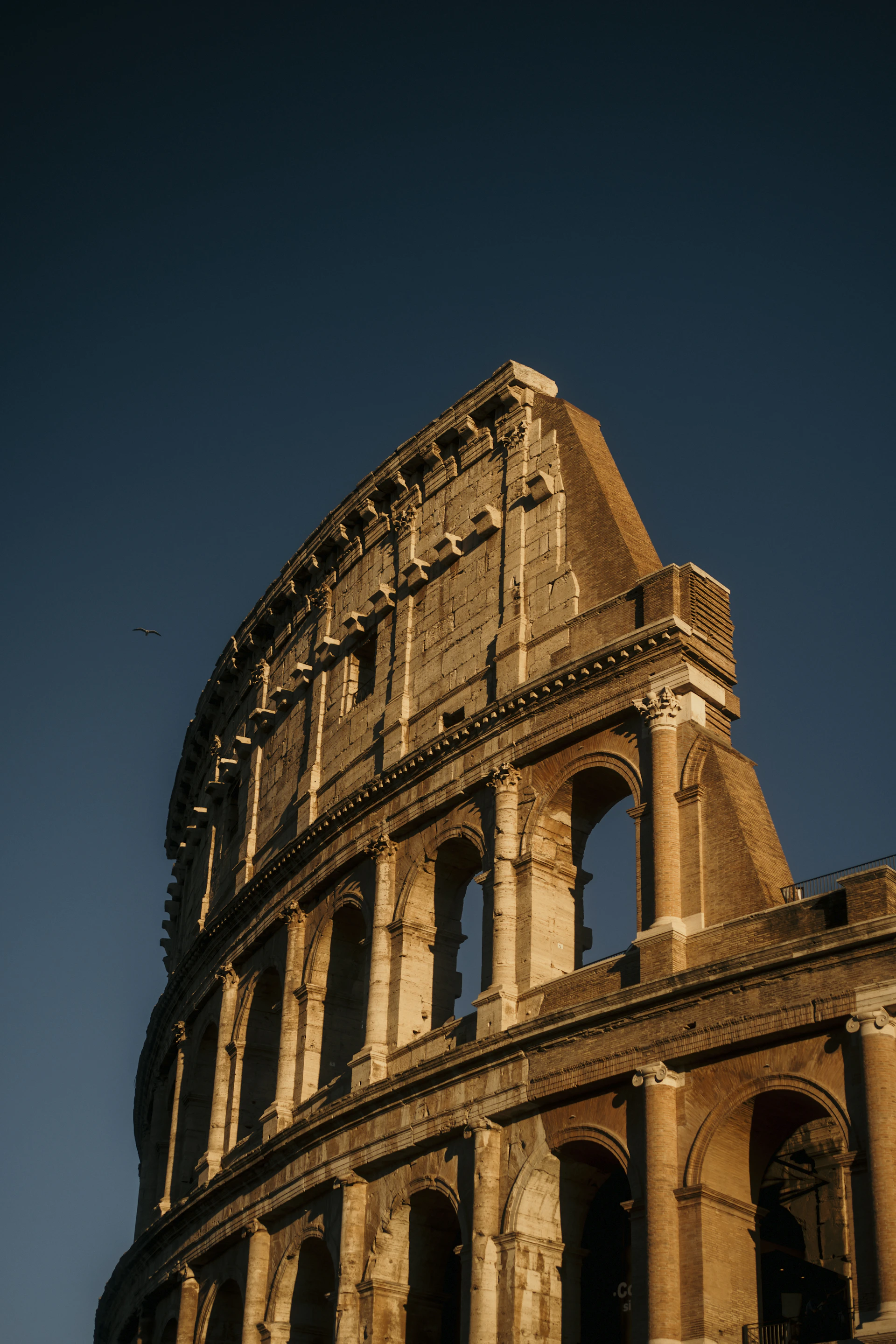 The ancient colosseum under a clear blue sky
