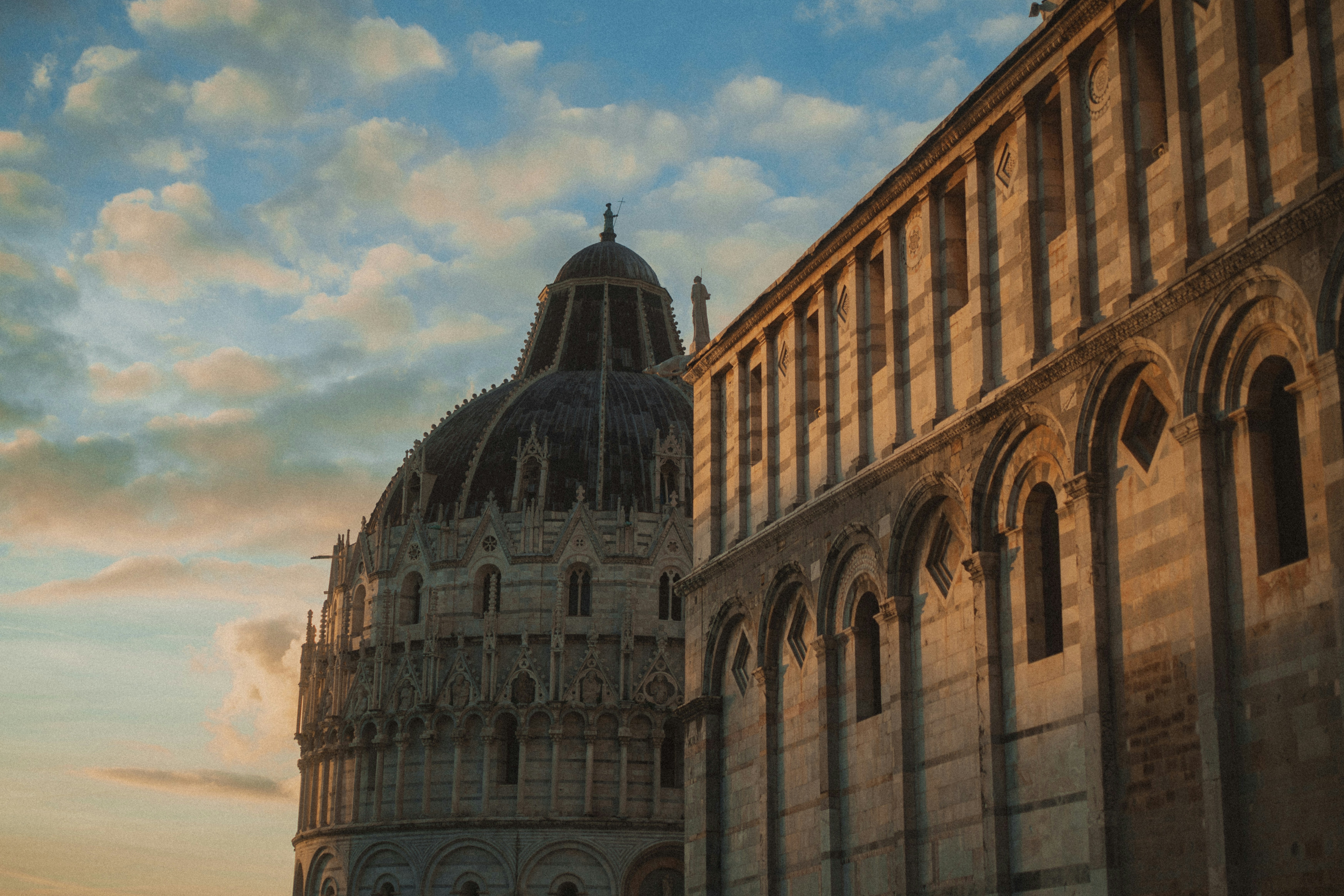 Historic domed building against a cloudy sky