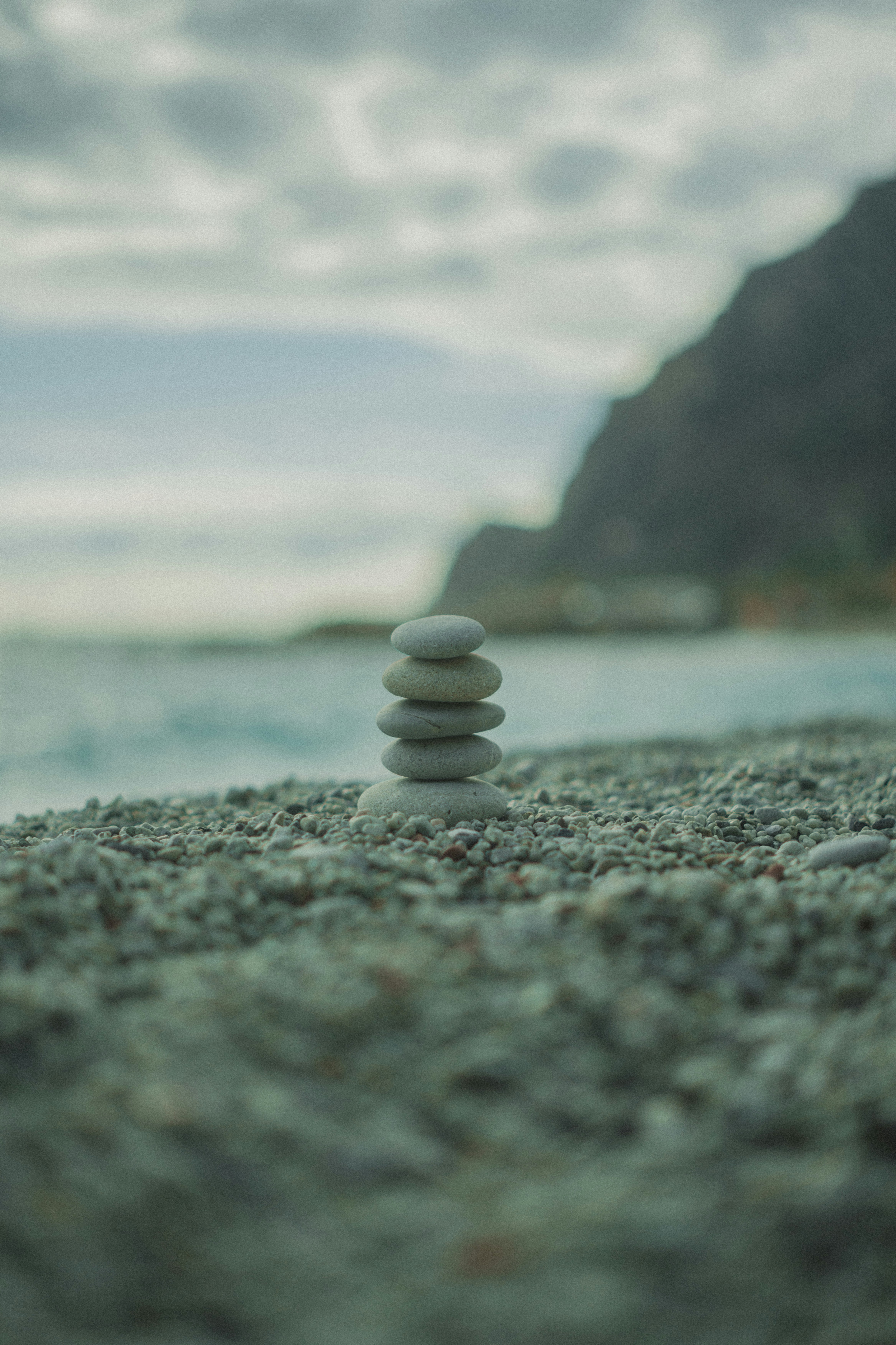 Stack of smooth stones on a pebble beach