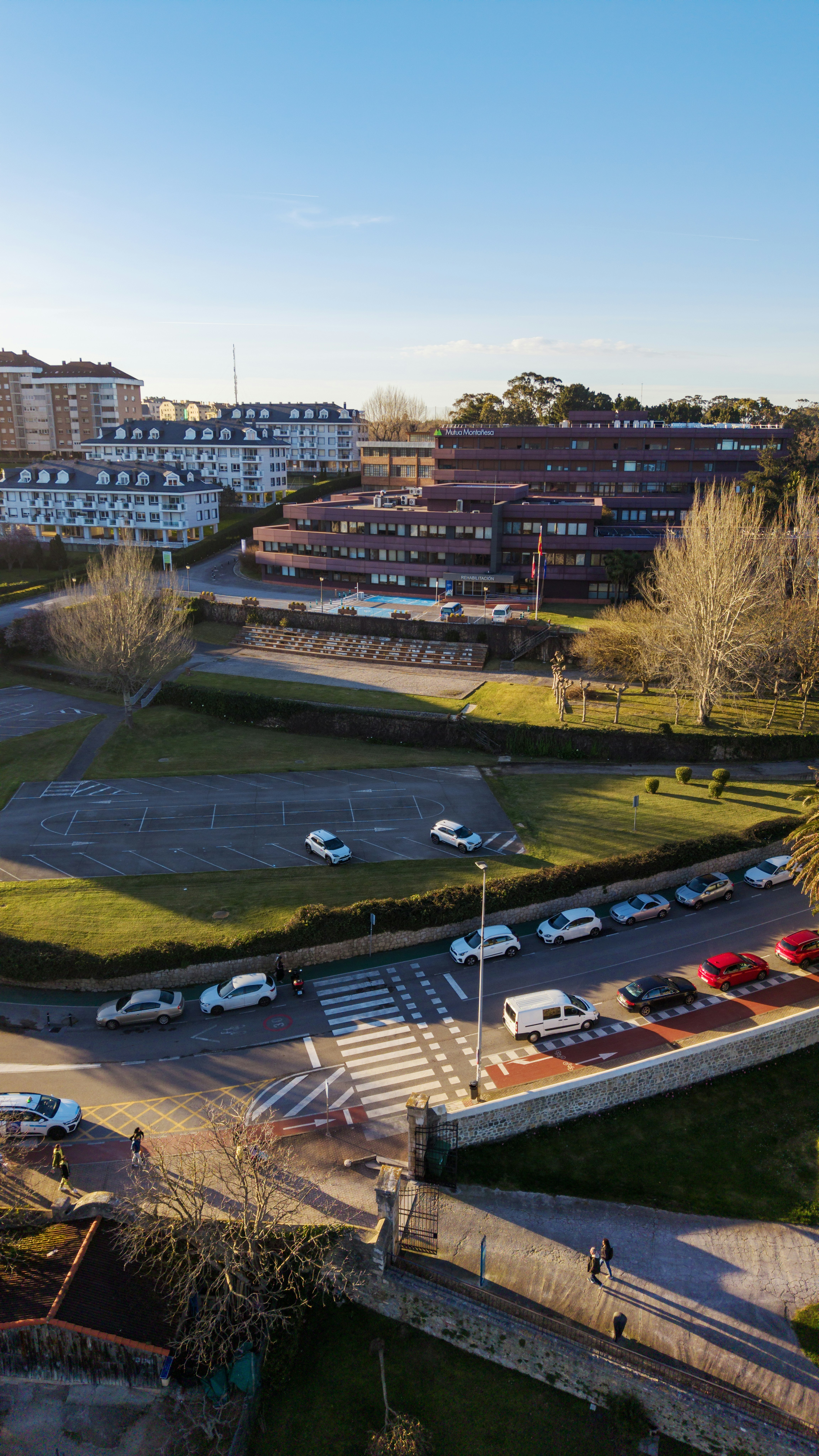Modern buildings and cars on a sunny day.