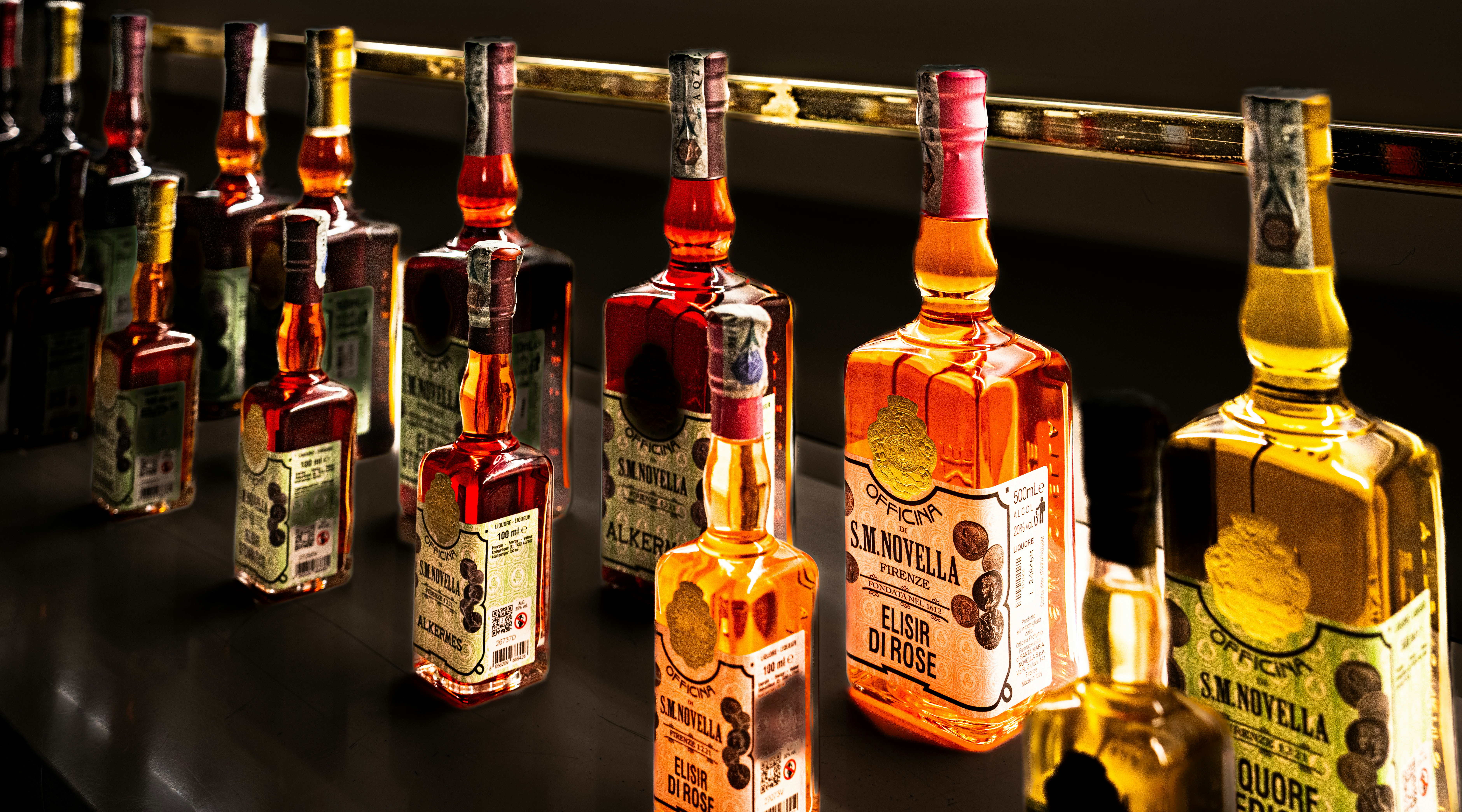 Assortment of whiskey bottles displayed on a shelf.