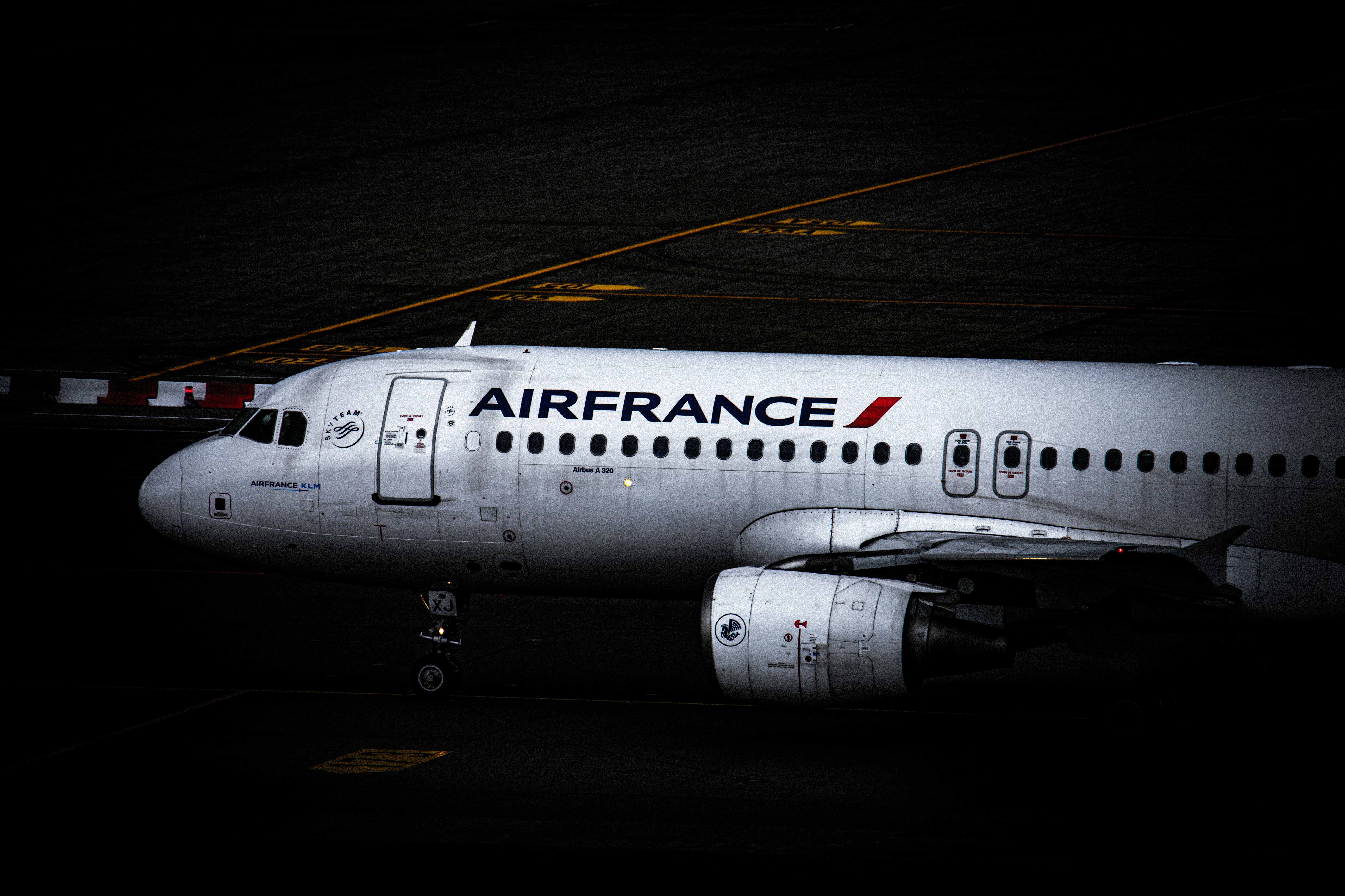 Air france airplane on the tarmac at night.