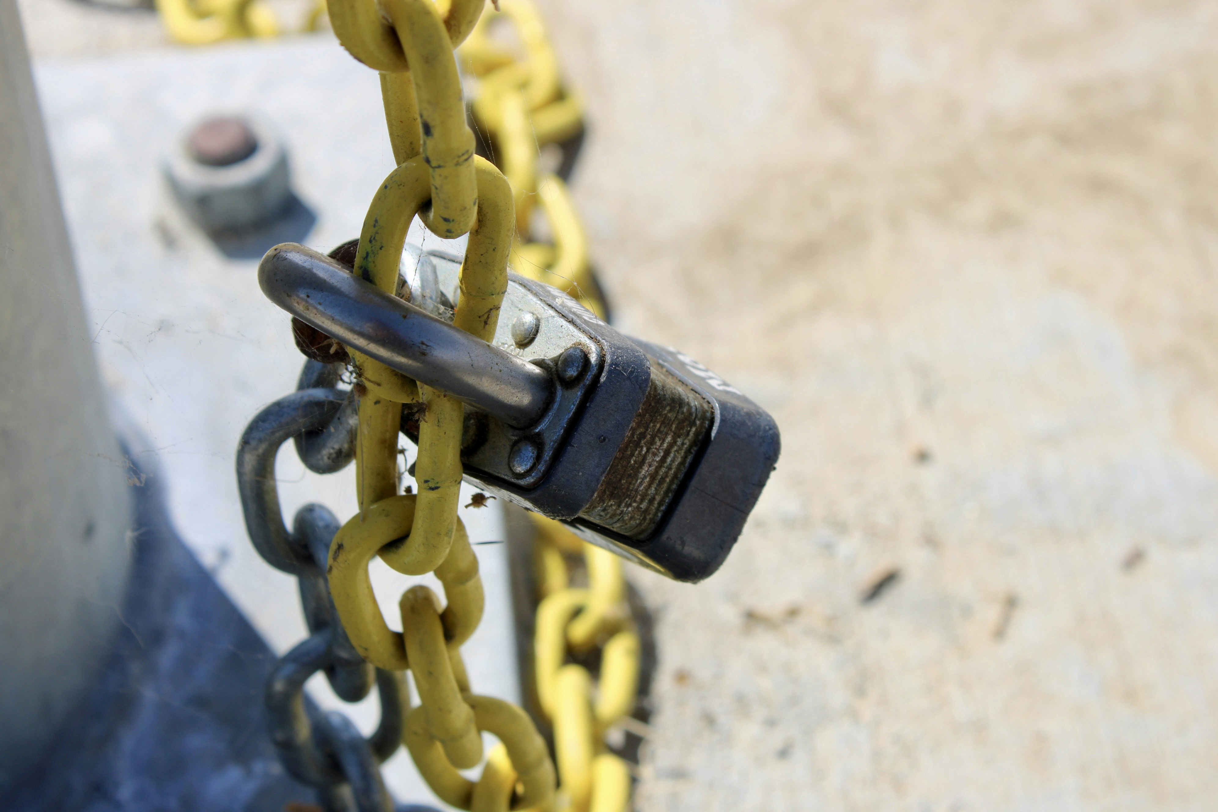 A close-up of a locked metal chain outdoors