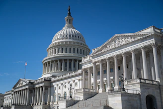 The united states capitol building under a clear blue sky