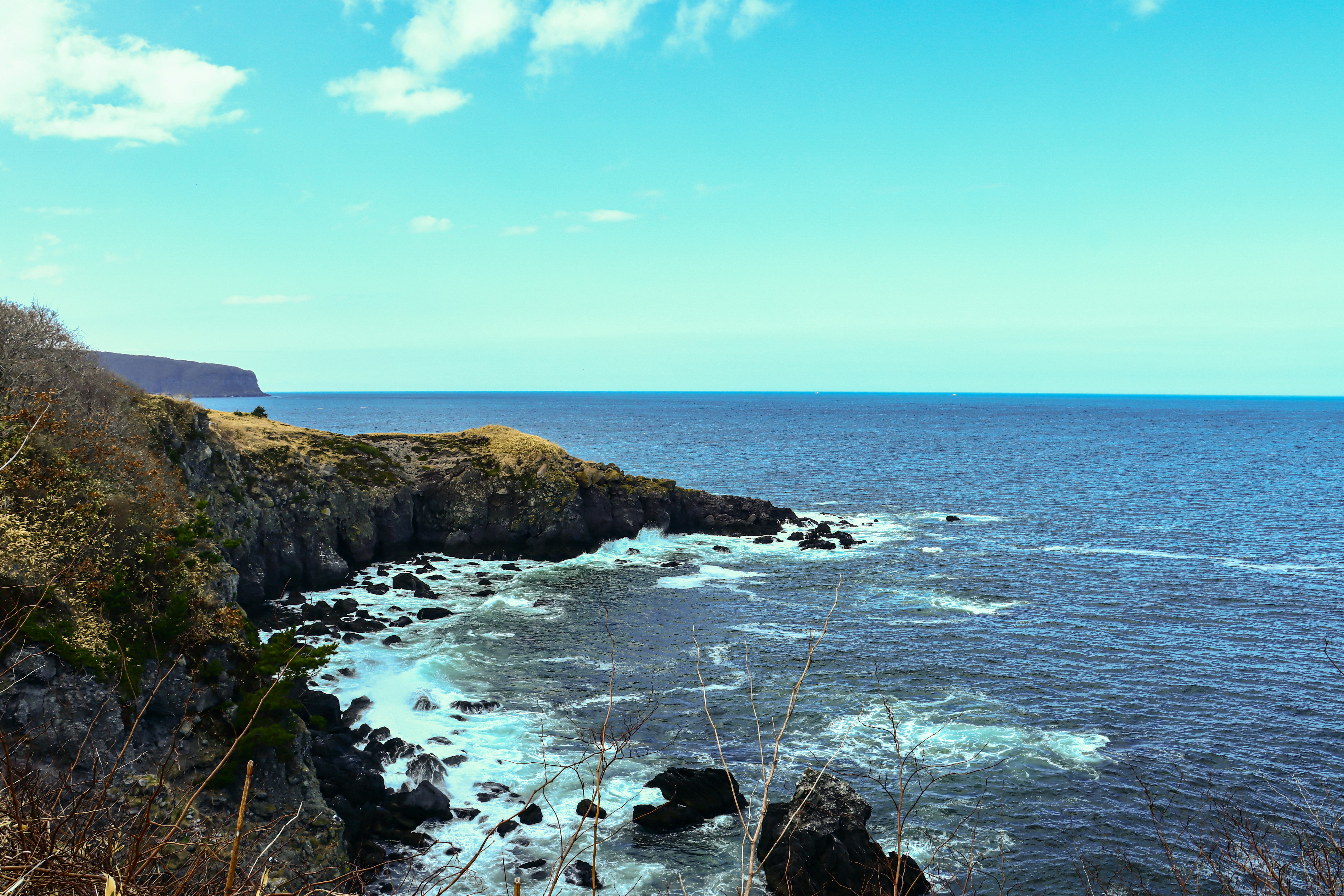 Rugged coastline with waves crashing on rocks