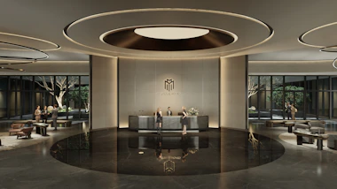 Modern hotel lobby with reception desk and seating areas.