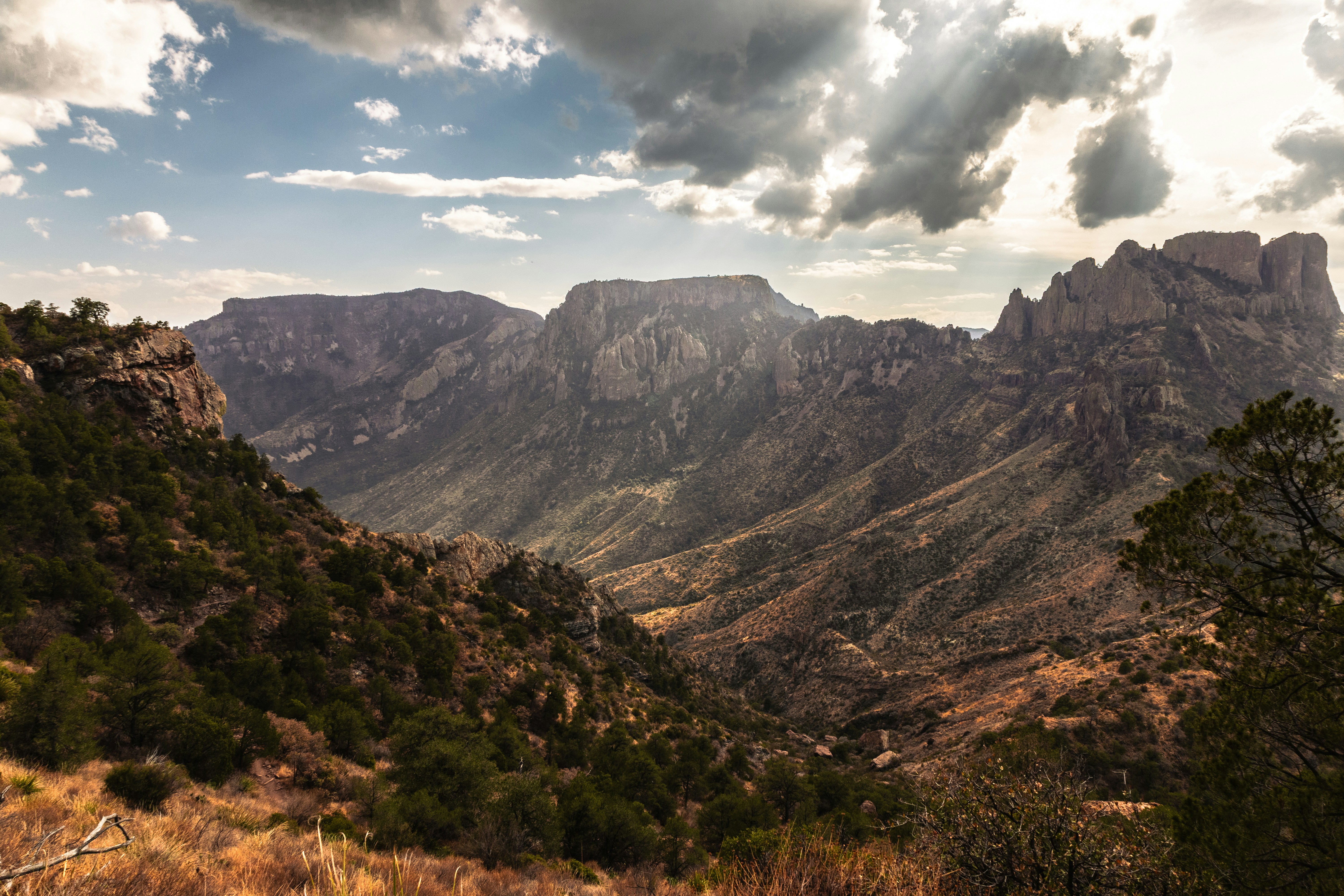 Rugged mountain range with dramatic clouds overhead