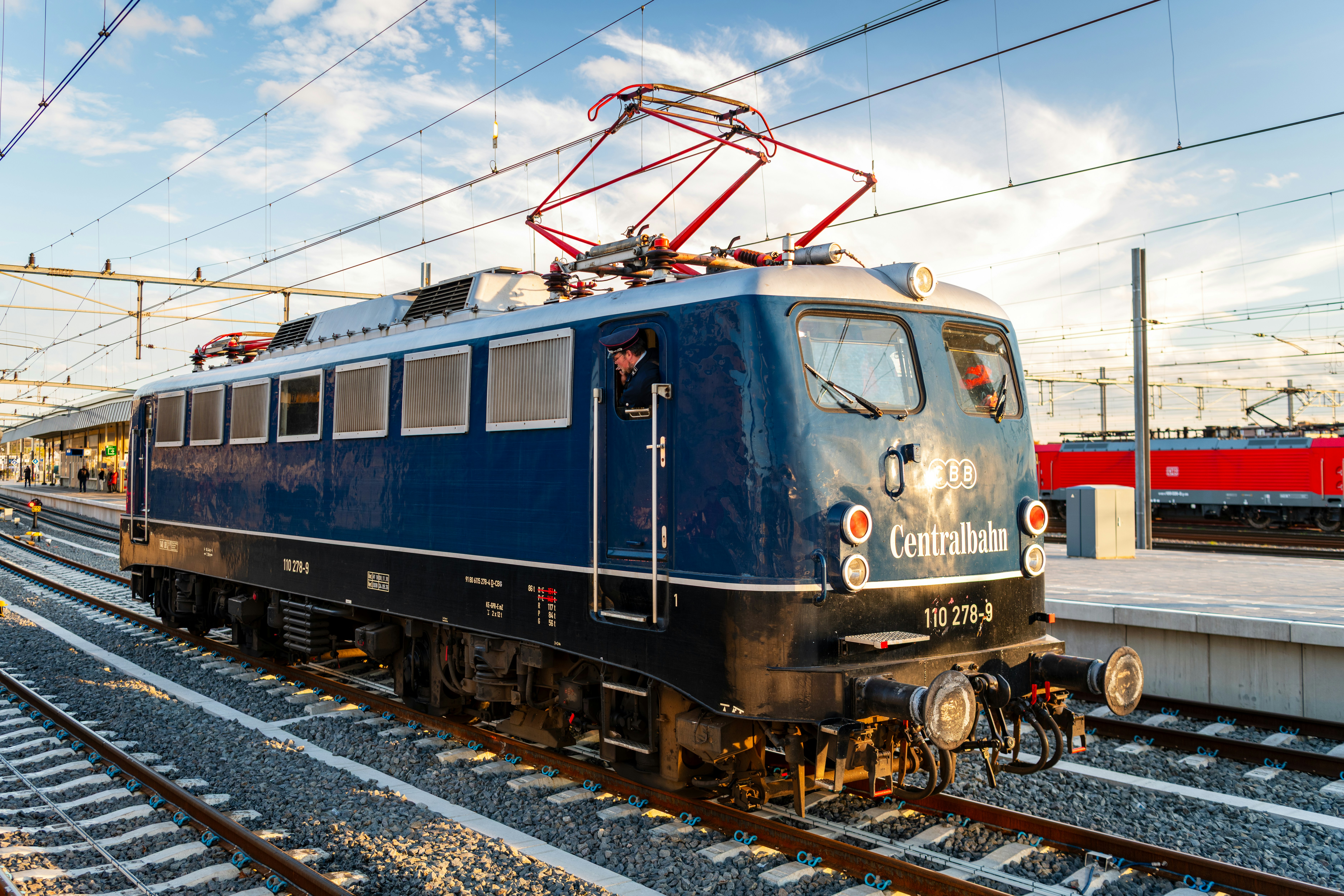 Blue electric train locomotive at a station
