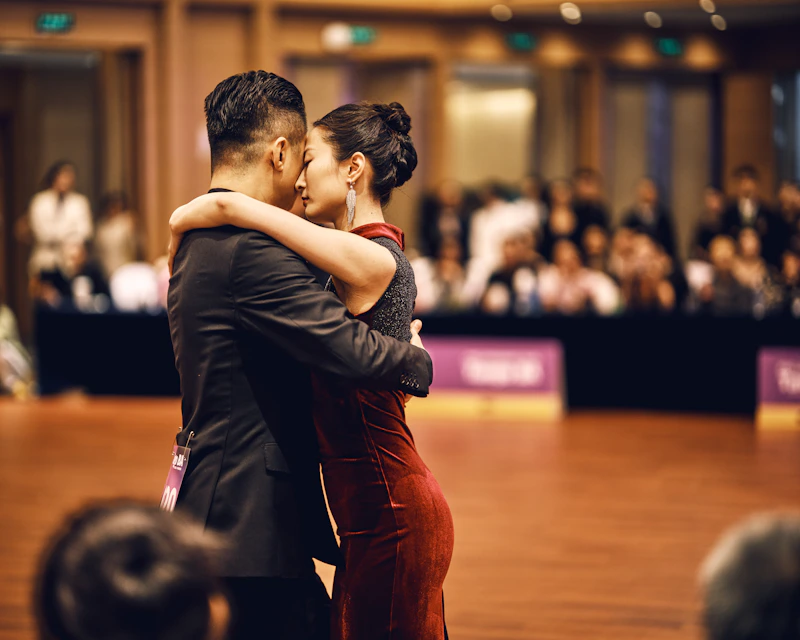 Elegant couple dancing in a ballroom competition