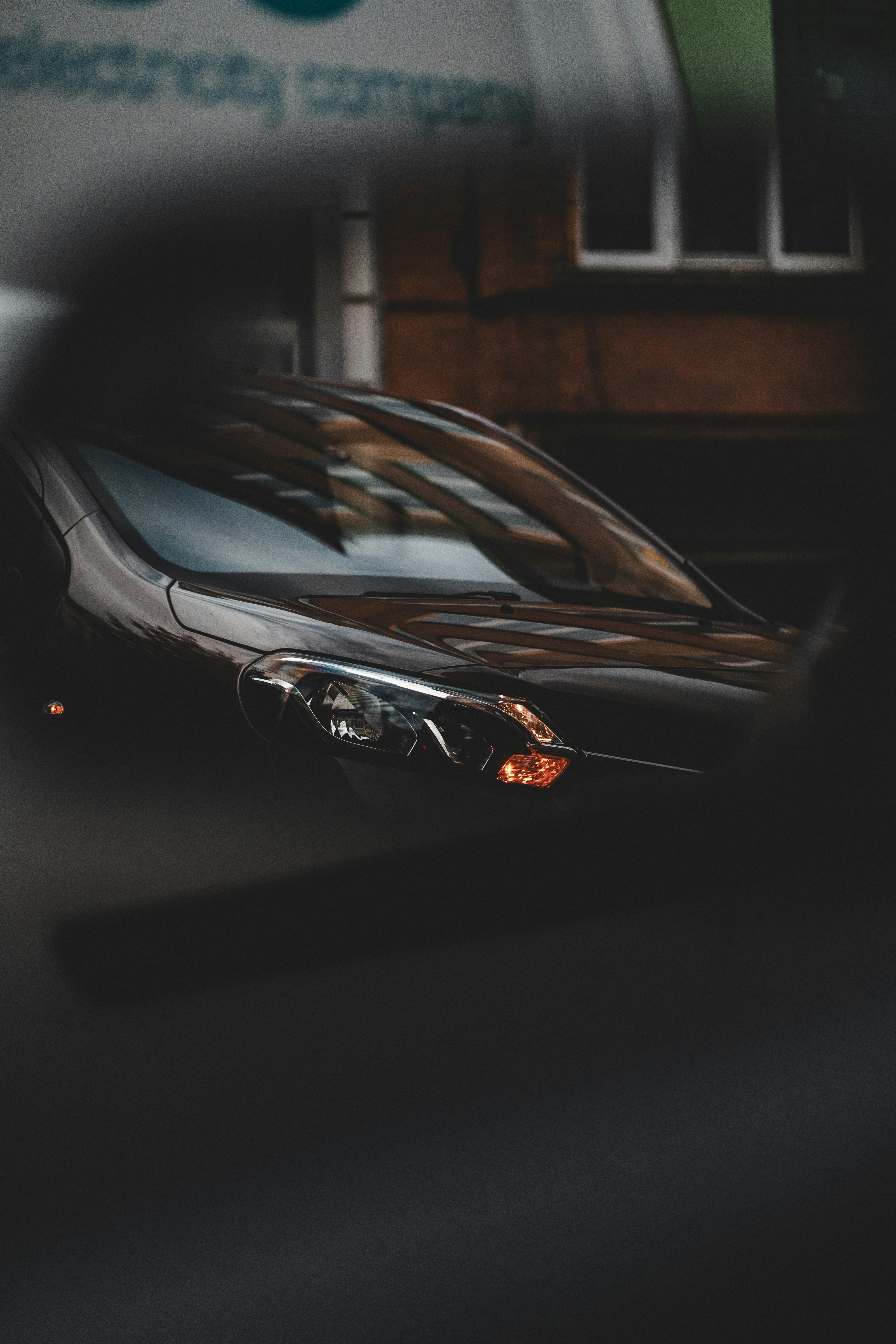 Dark car parked on a street