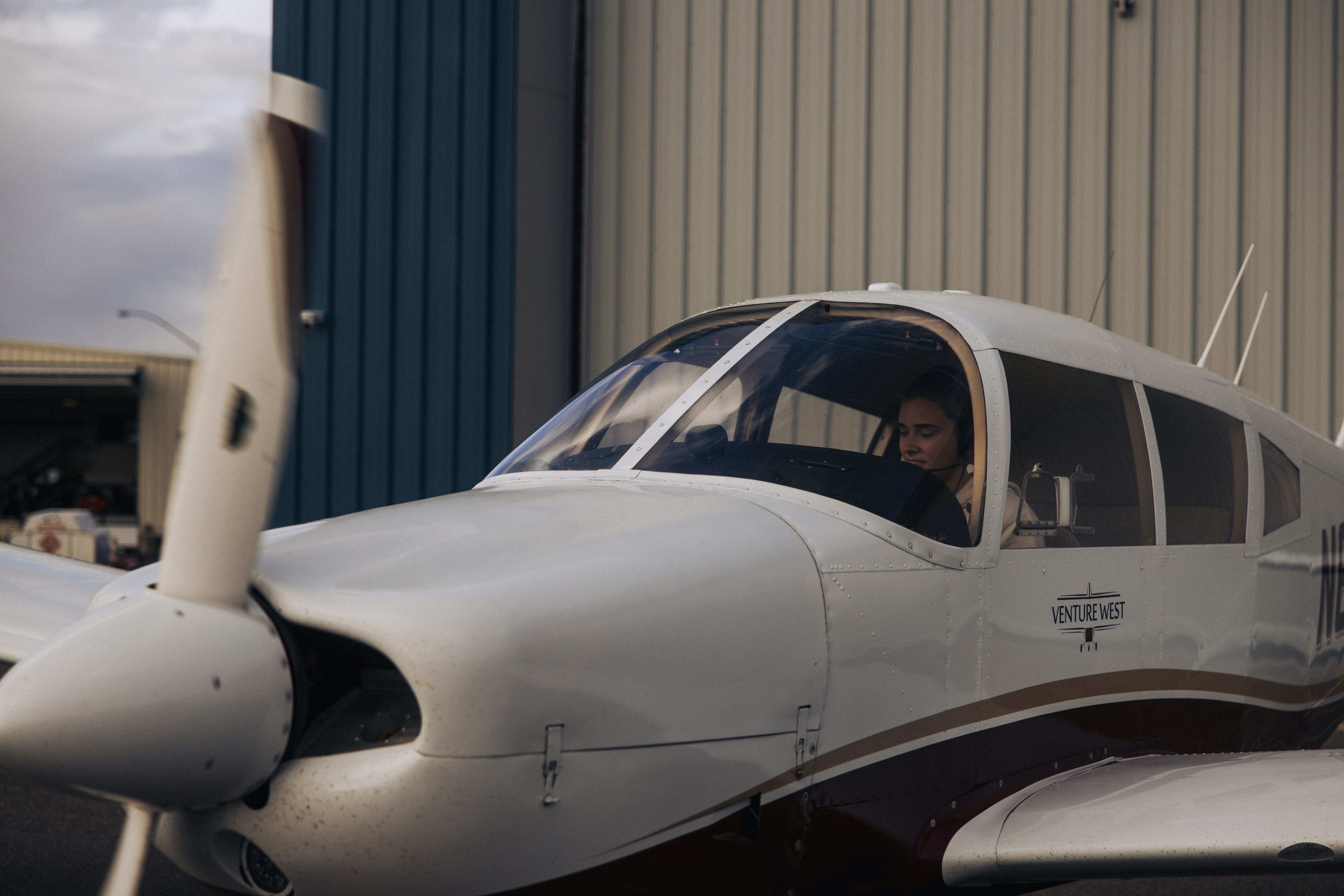 Pilot in cockpit of small airplane ready airplane
