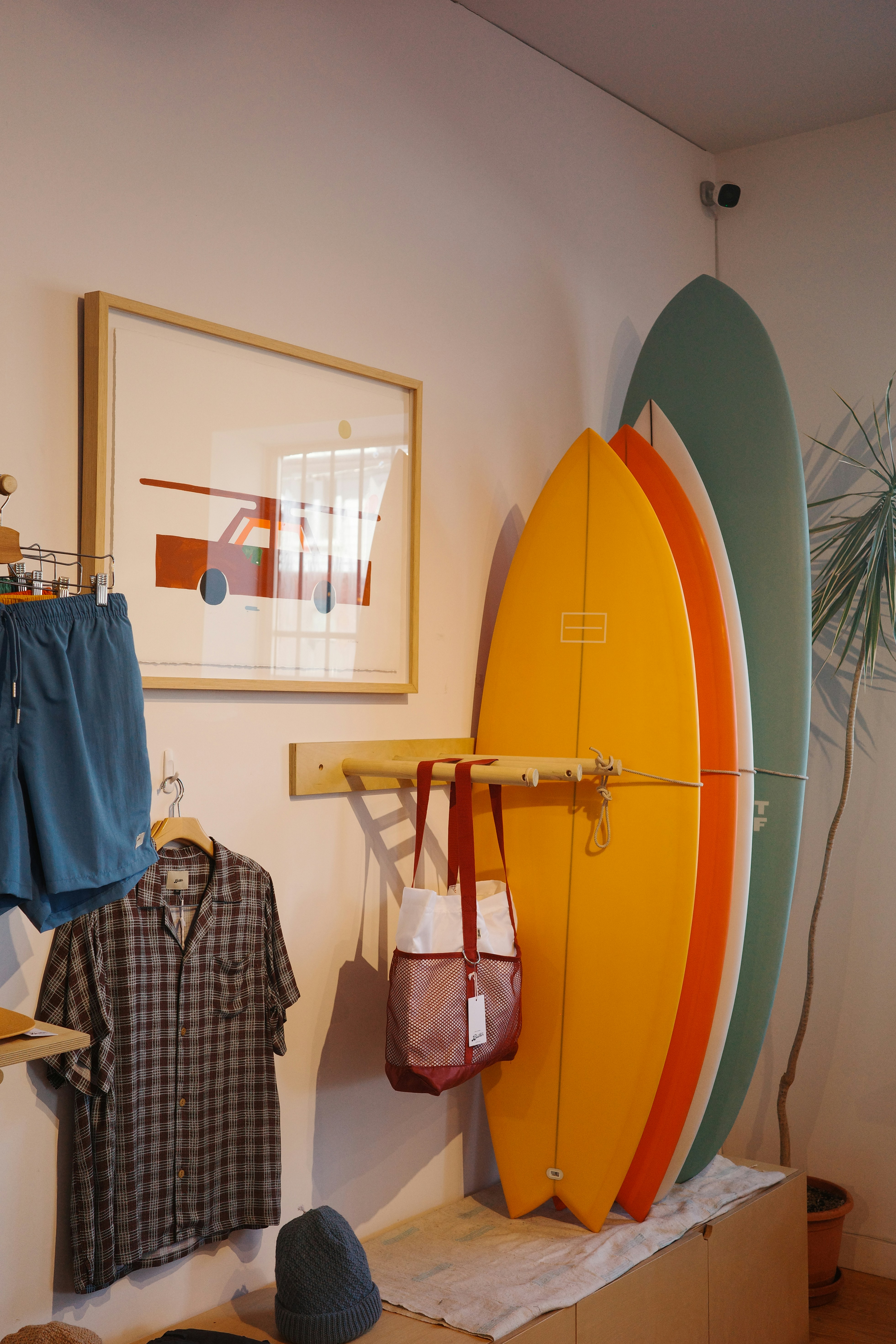 Surfboards and apparel displayed in a store.
