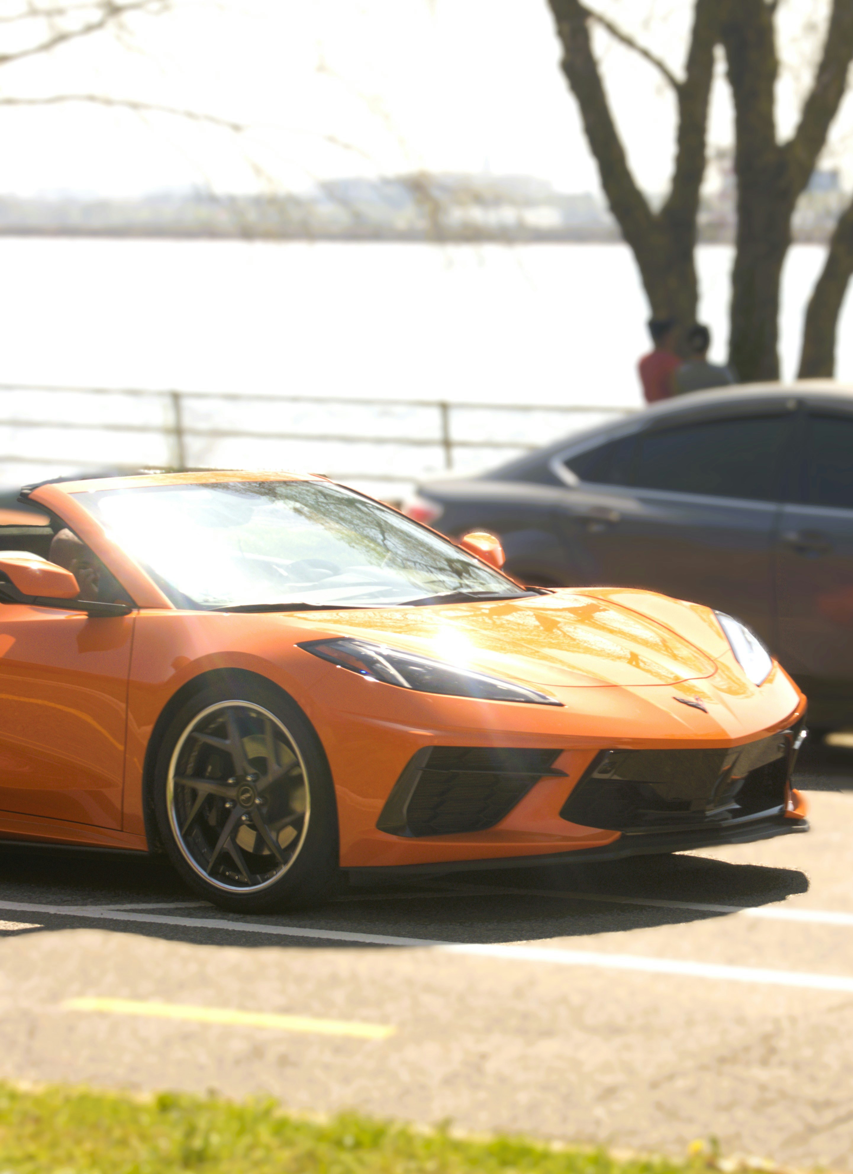 Orange convertible sports car parked outdoors
