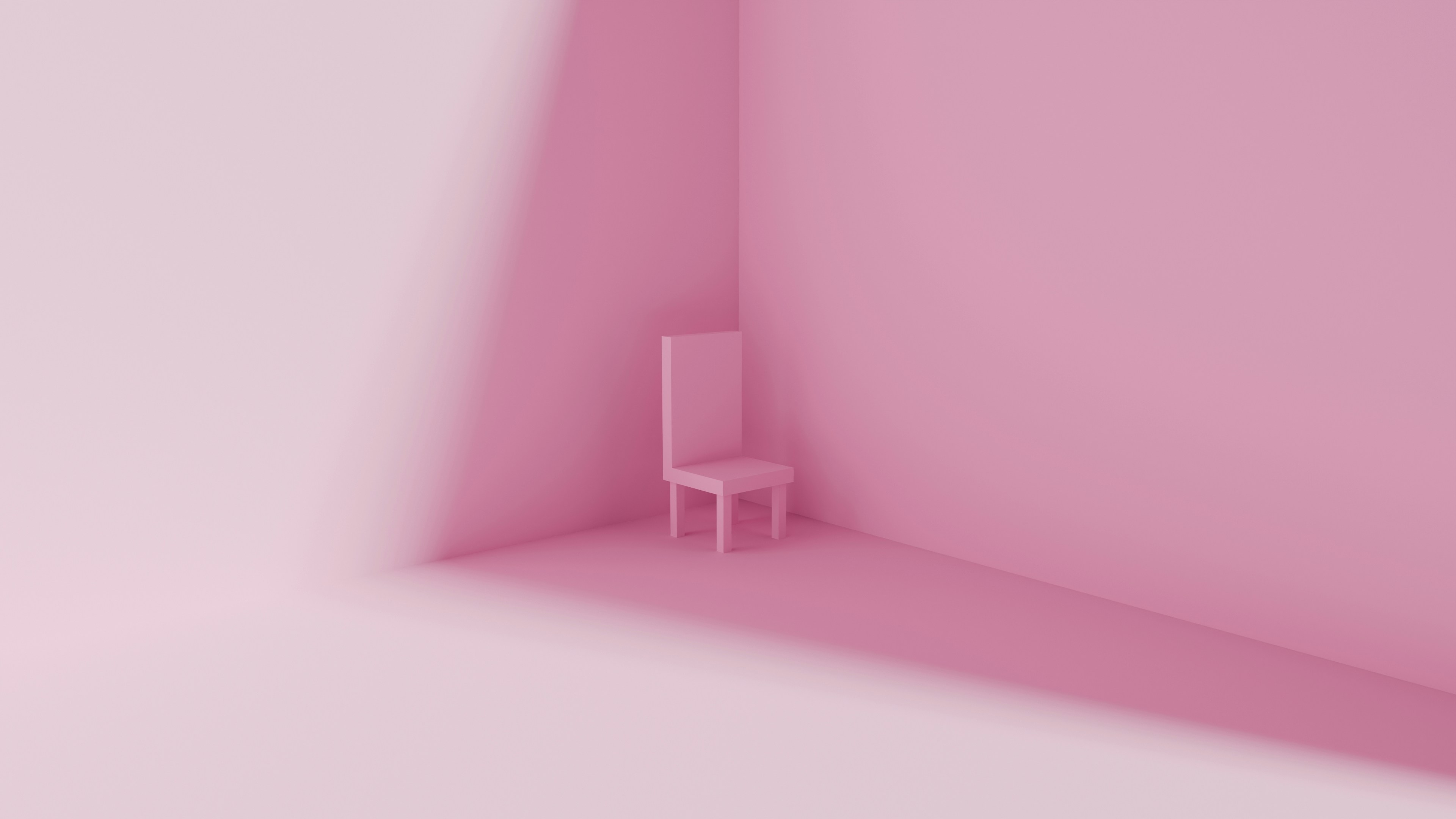 Une seule chaise rose dans une pièce minimaliste rose.