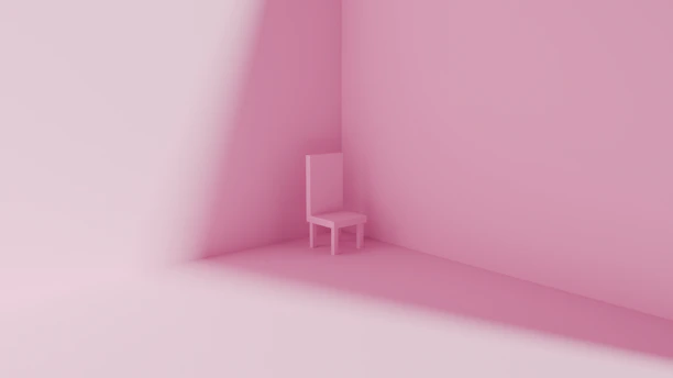 A single pink chair in a minimalist pink room