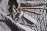 Manicure tools laid out on a white towel.