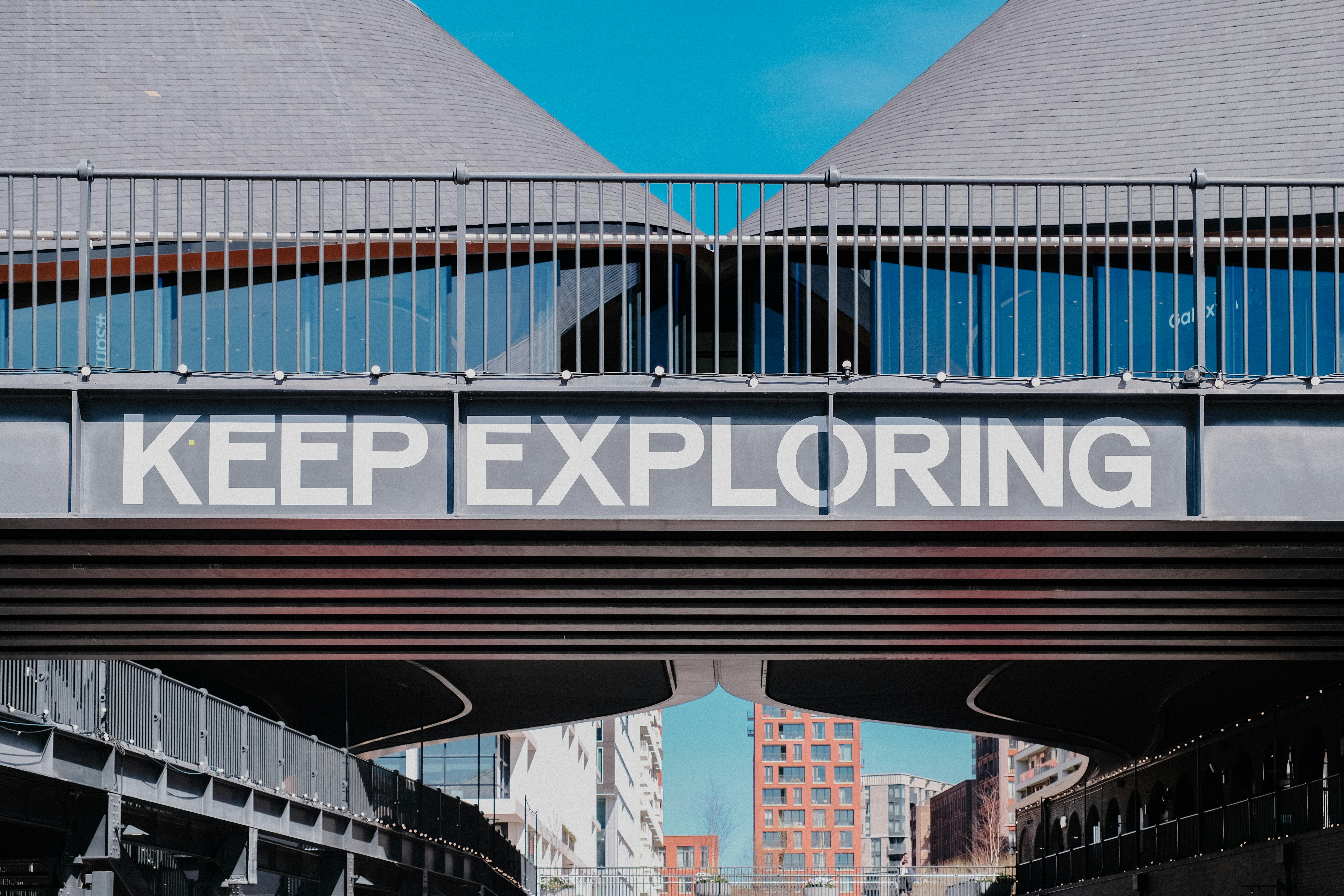 Keep exploring text on a bridge overpass