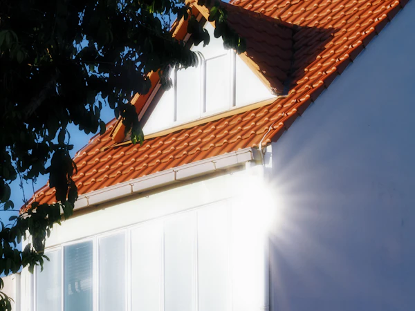 Designing for San Diego Heat and Sun: Sunlight glinting off a white wall of a house.