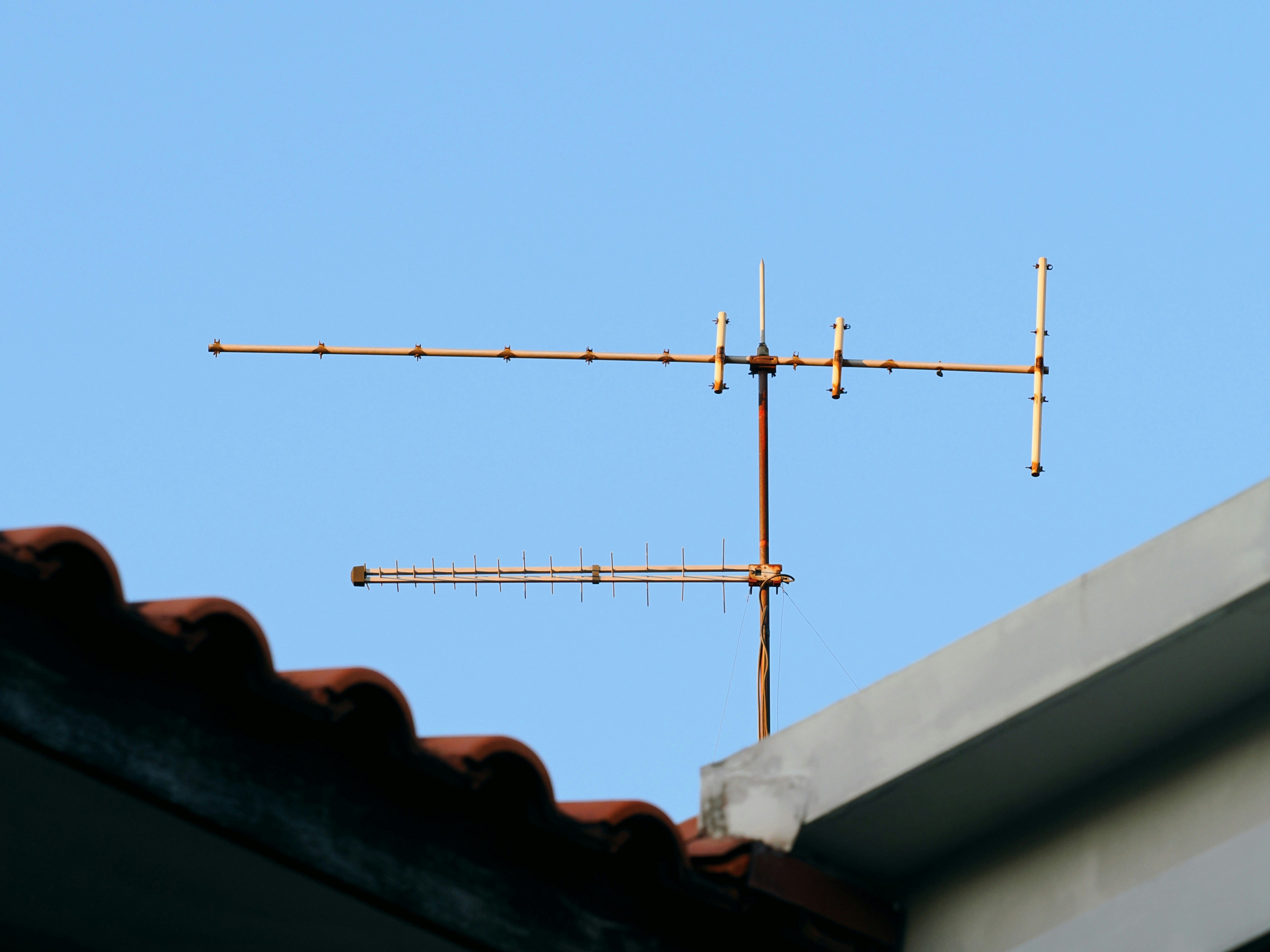 An old television antenna on a rooftop