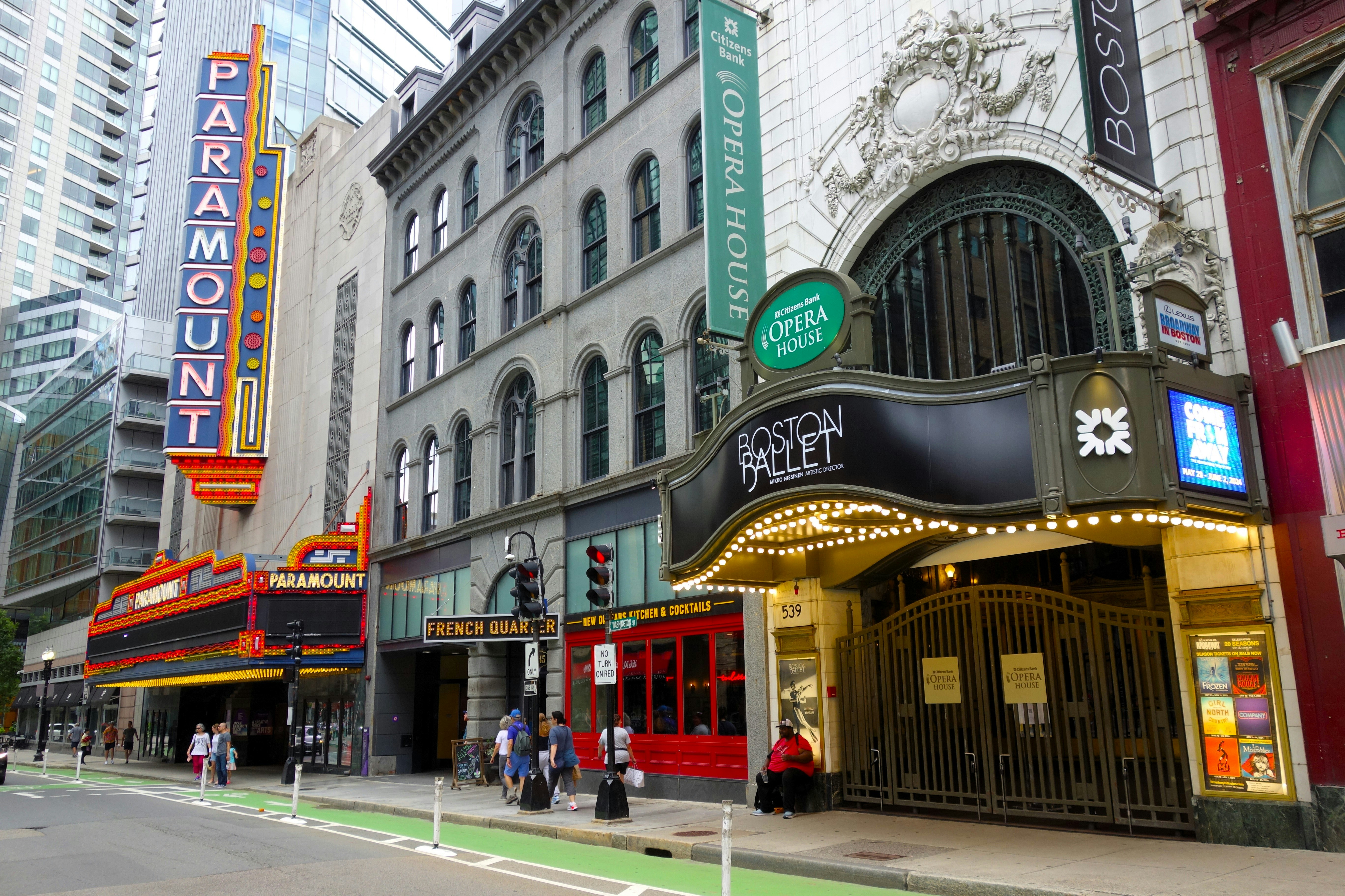 Paramount and boston opera house buildings on a city street